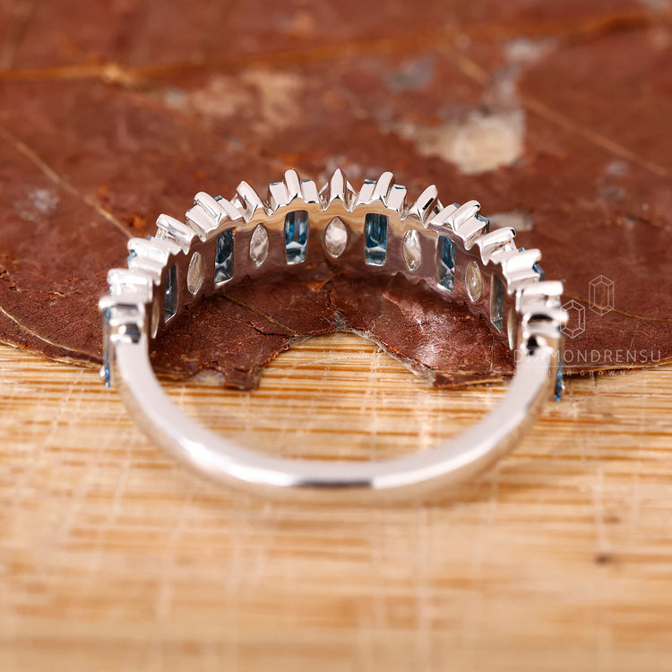 Handmade jewellery with a half eternity white gold band and mixed diamonds.