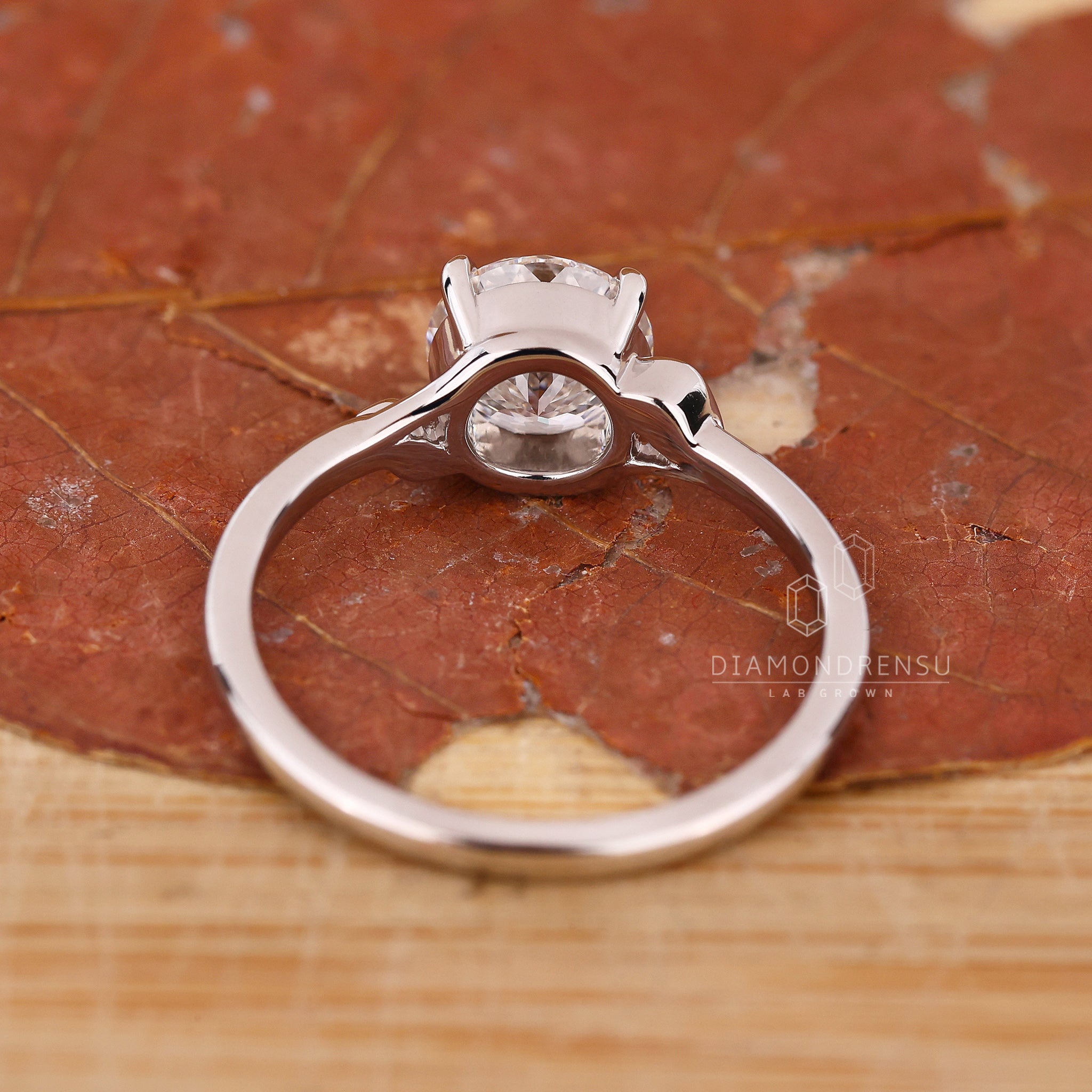 Custom engagement ring with white gold ring.
