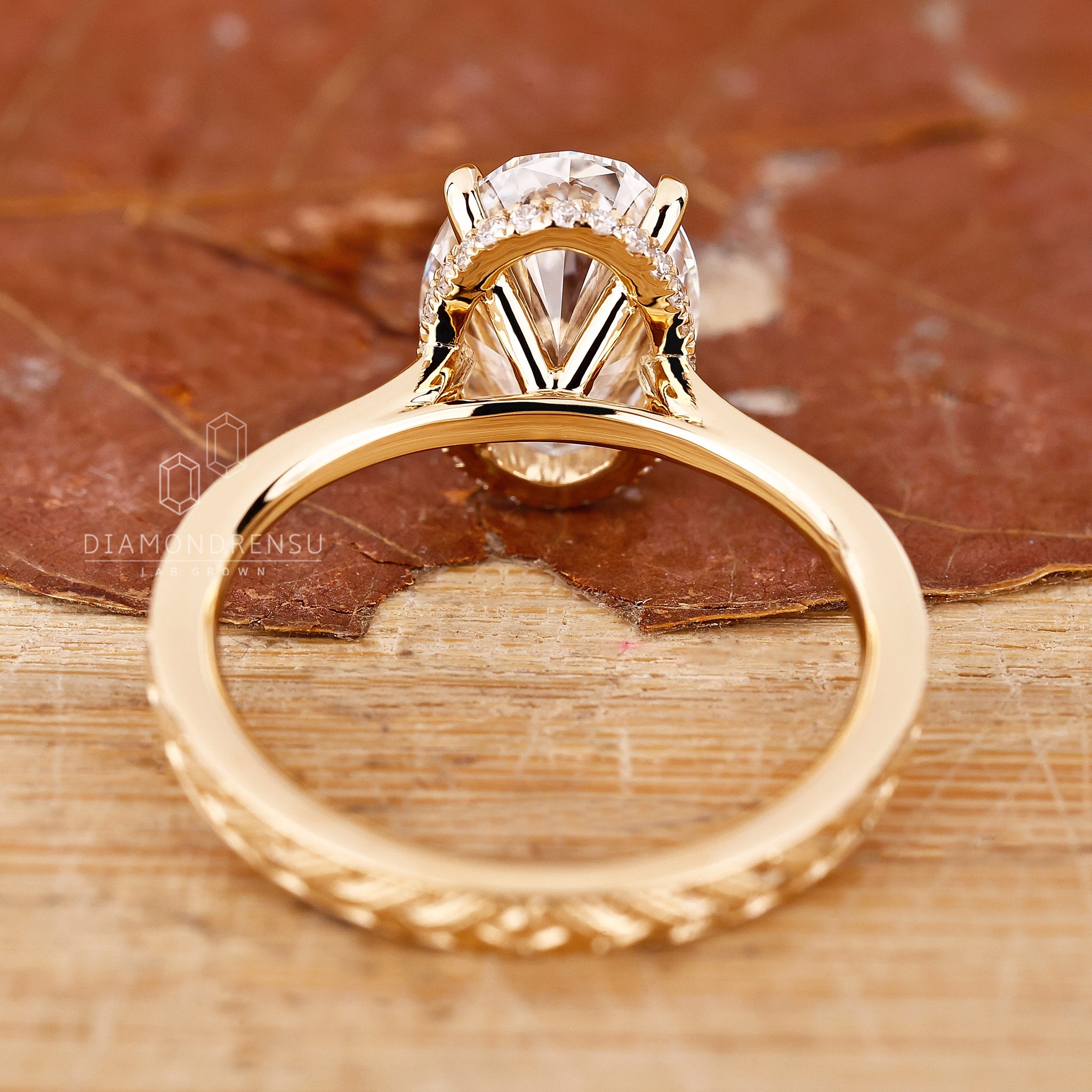 Handmade jewellery ring featuring round cut emerald gemstone and claw setting.
