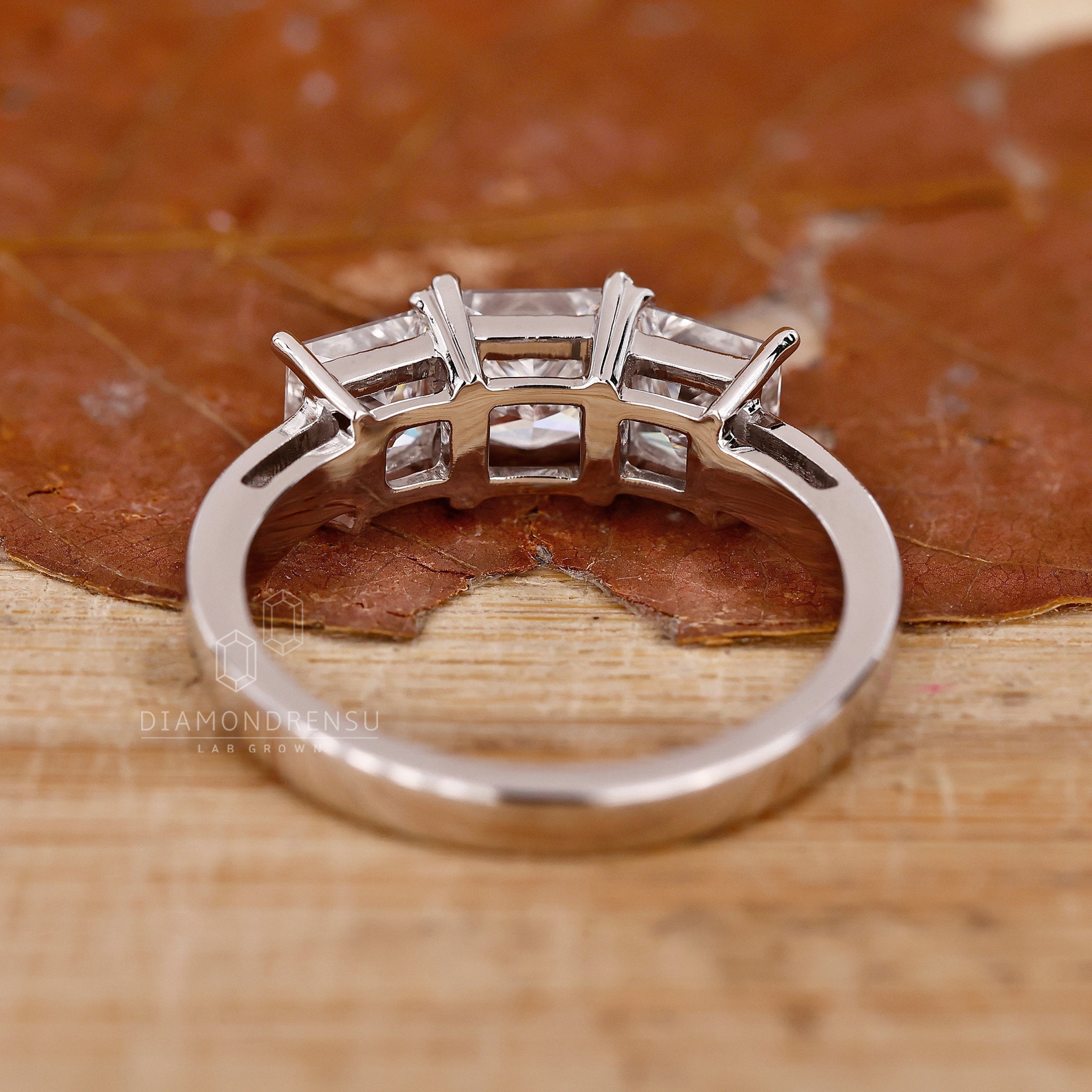 Lab grown diamond 3 stone ring in prong setting design

