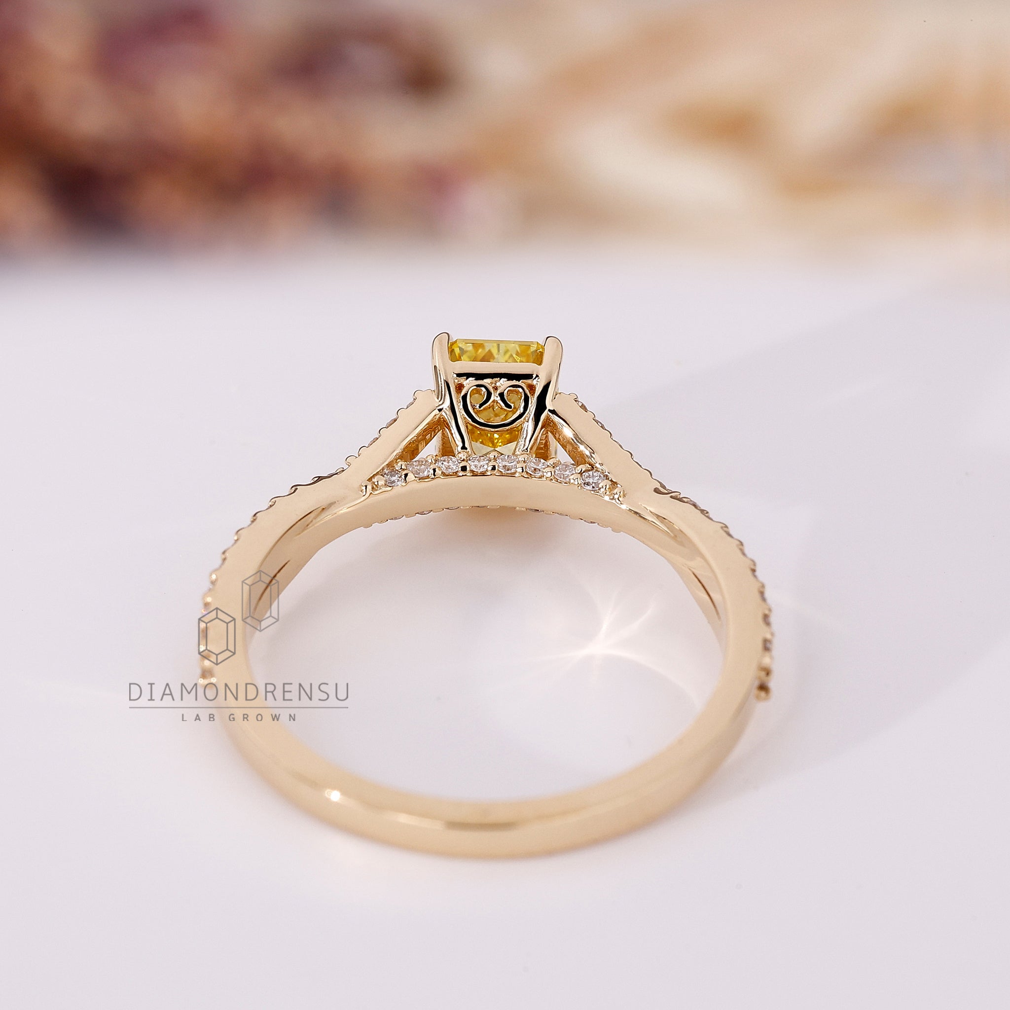 Radiant yellow diamond ring made with lab grown diamond.
