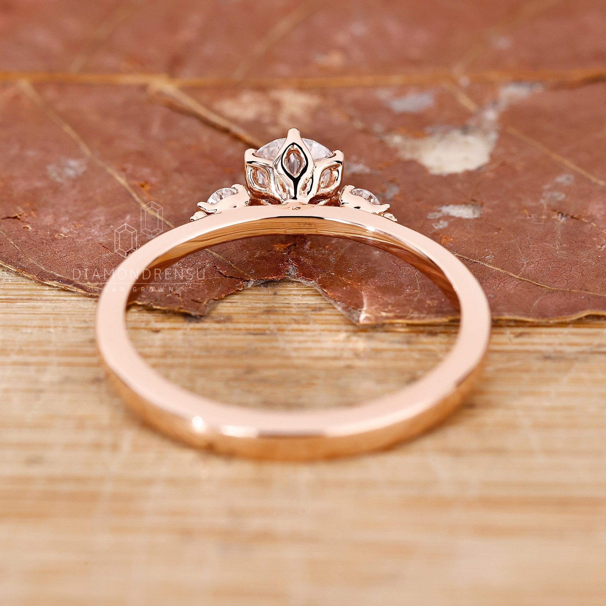 Unique engagement ring includes three stone look.
