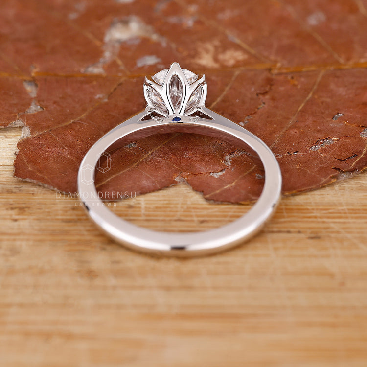 Tulip setting ring with lab grown round diamond and prong mount.
