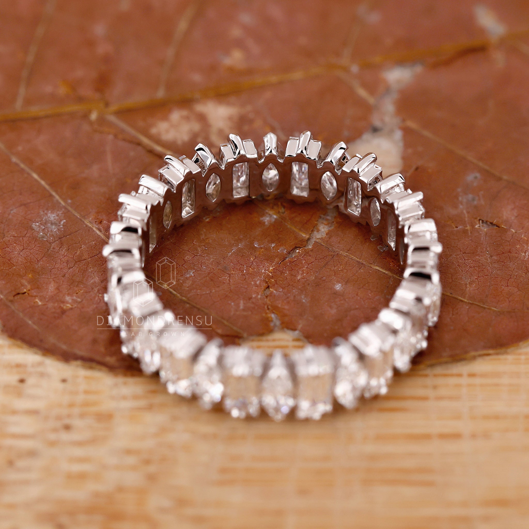 Lab diamond wedding band with mixed shapes.
