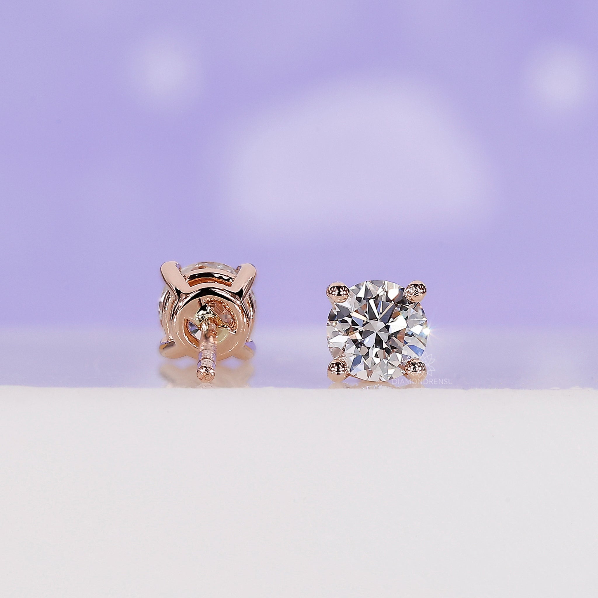 Elegant rose gold handmade earrings set with lab grown round diamonds.