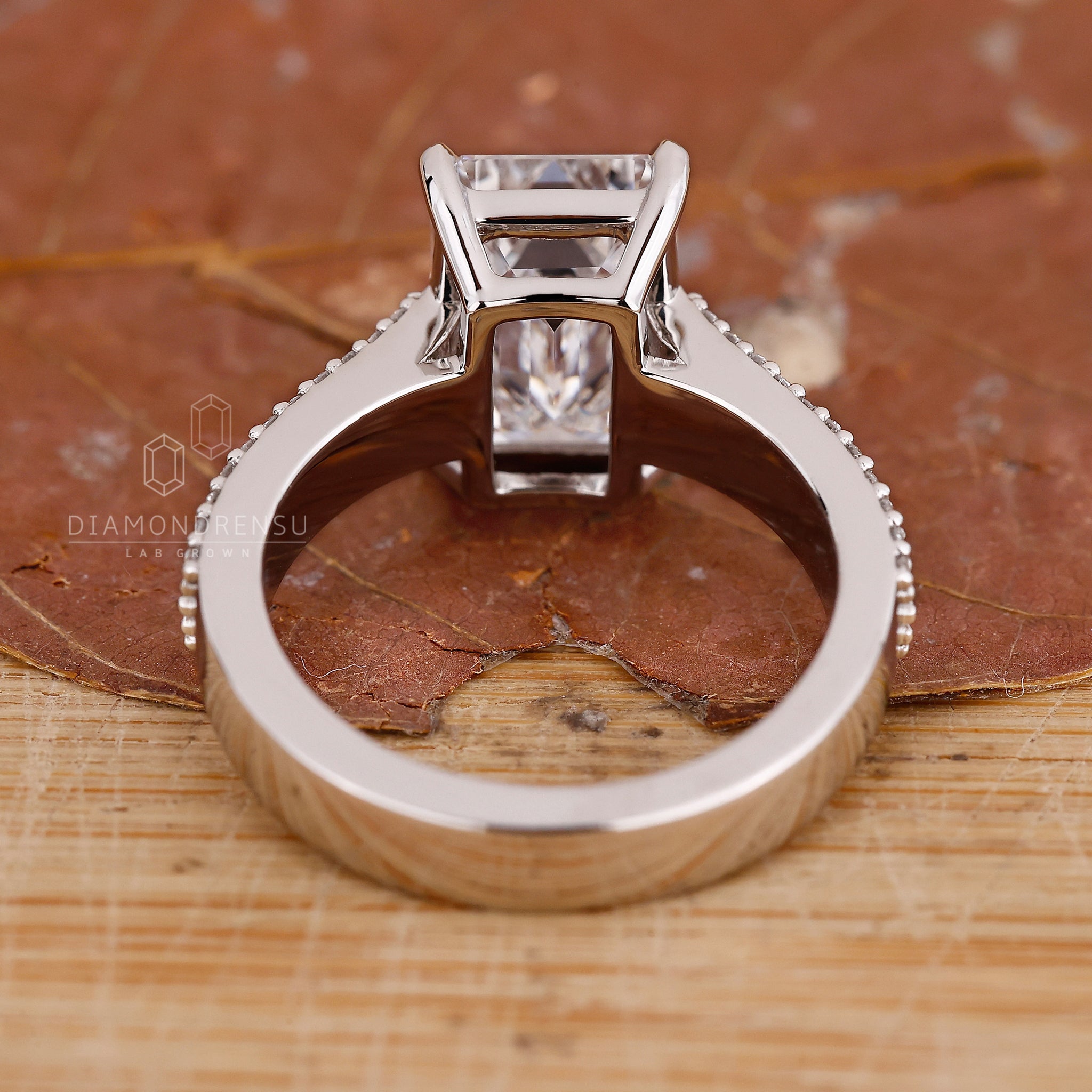 Handmade ring with V shaped prong and marquise diamond details.
