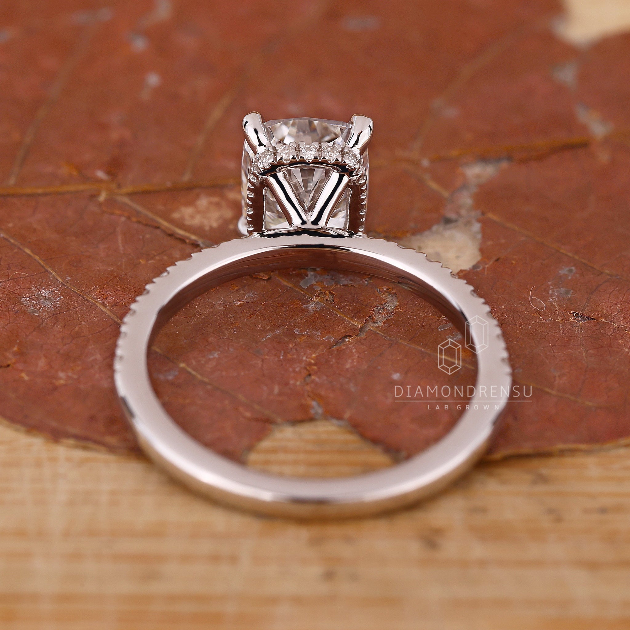 Cushion diamond engagement ring from Diamondrensu UK in hidden halo design.
