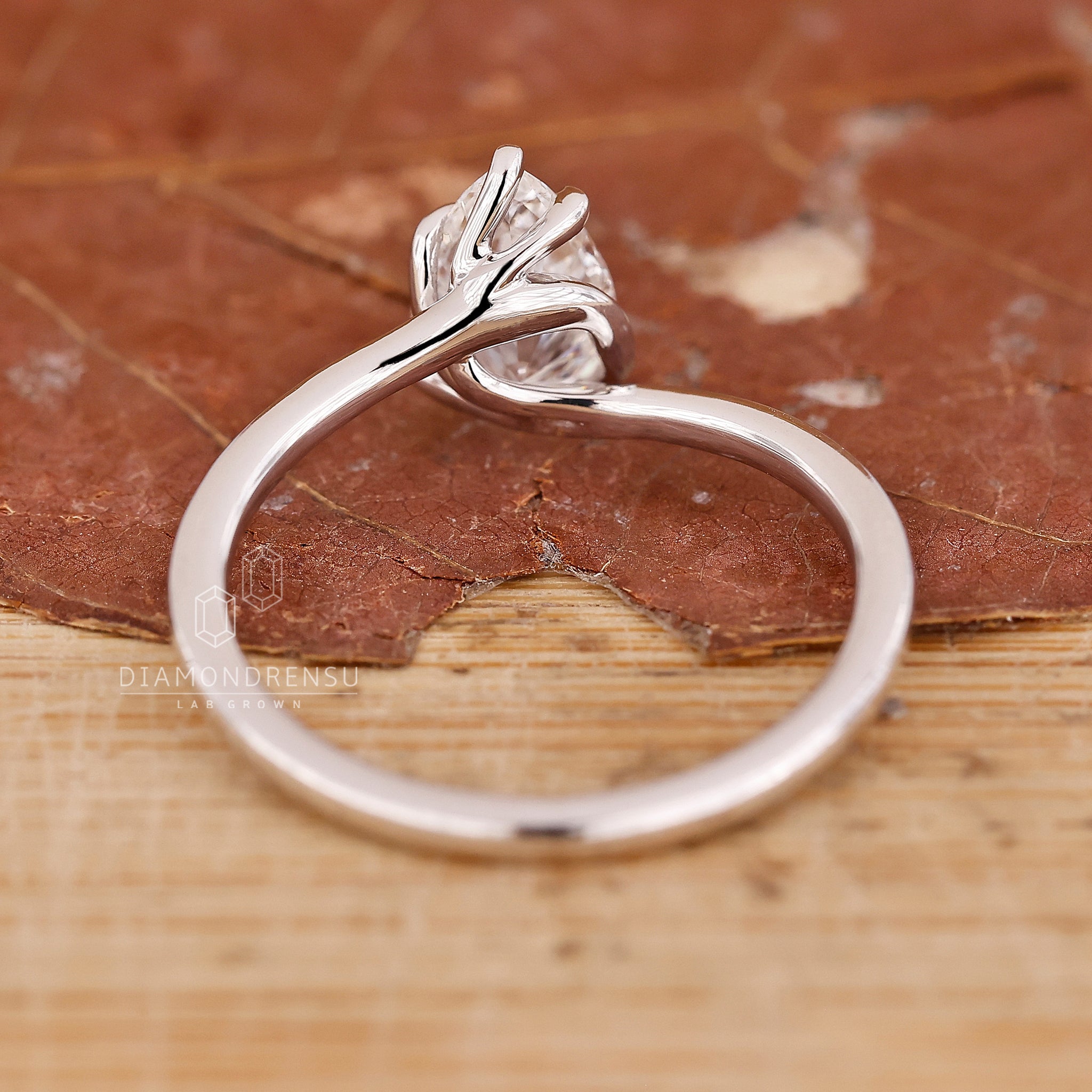 Elegant solitaire engagement ring with pear shaped diamond.
