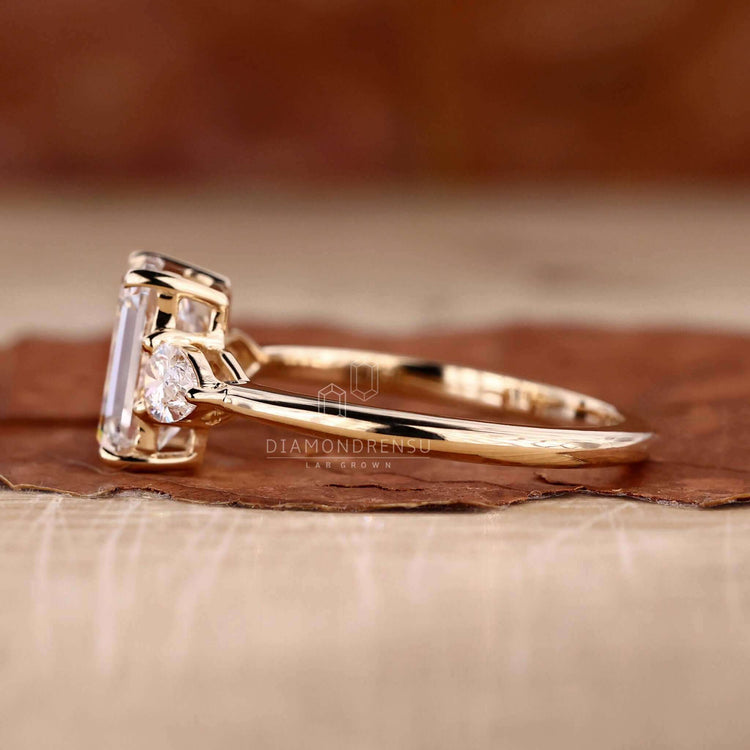Emerald engagement ring with lab grown diamond, igi certified.