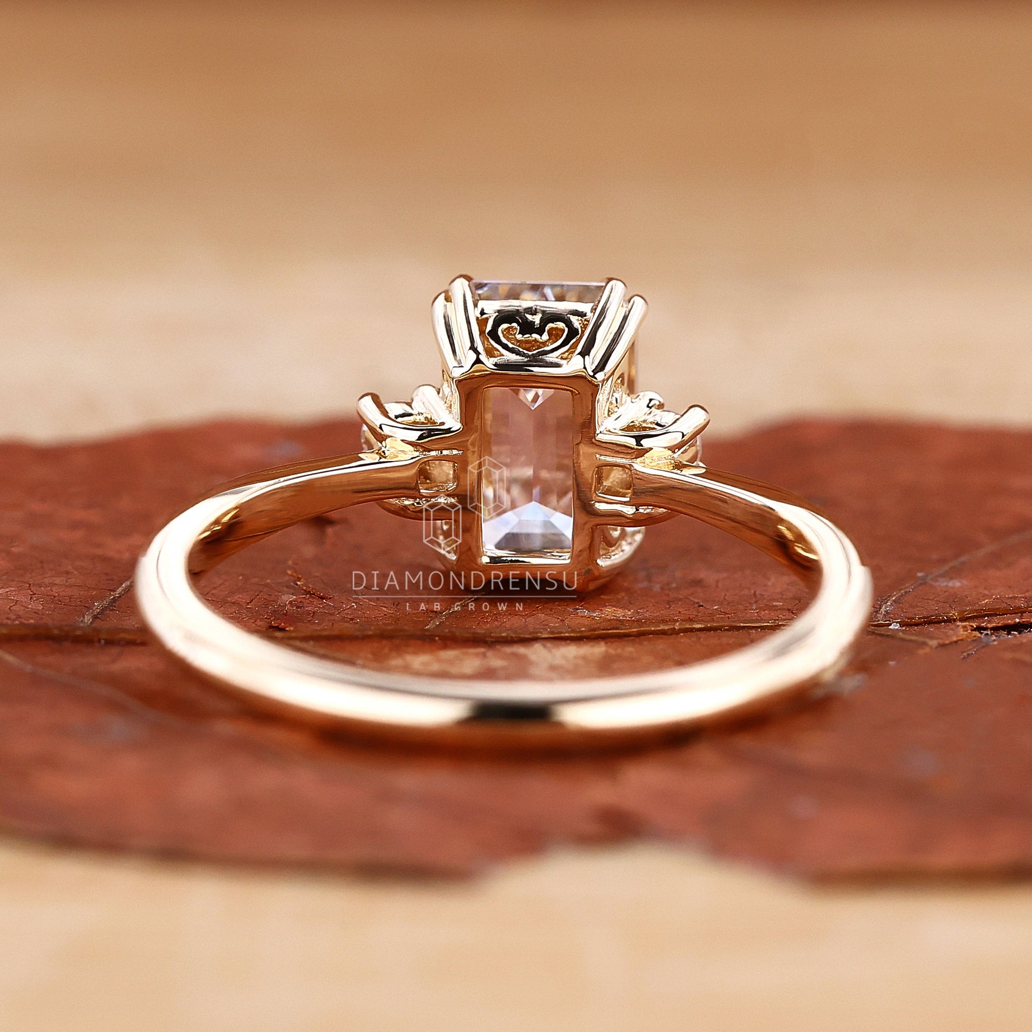 Emerald cut ring with flawless diamonds in a timeless setting.
