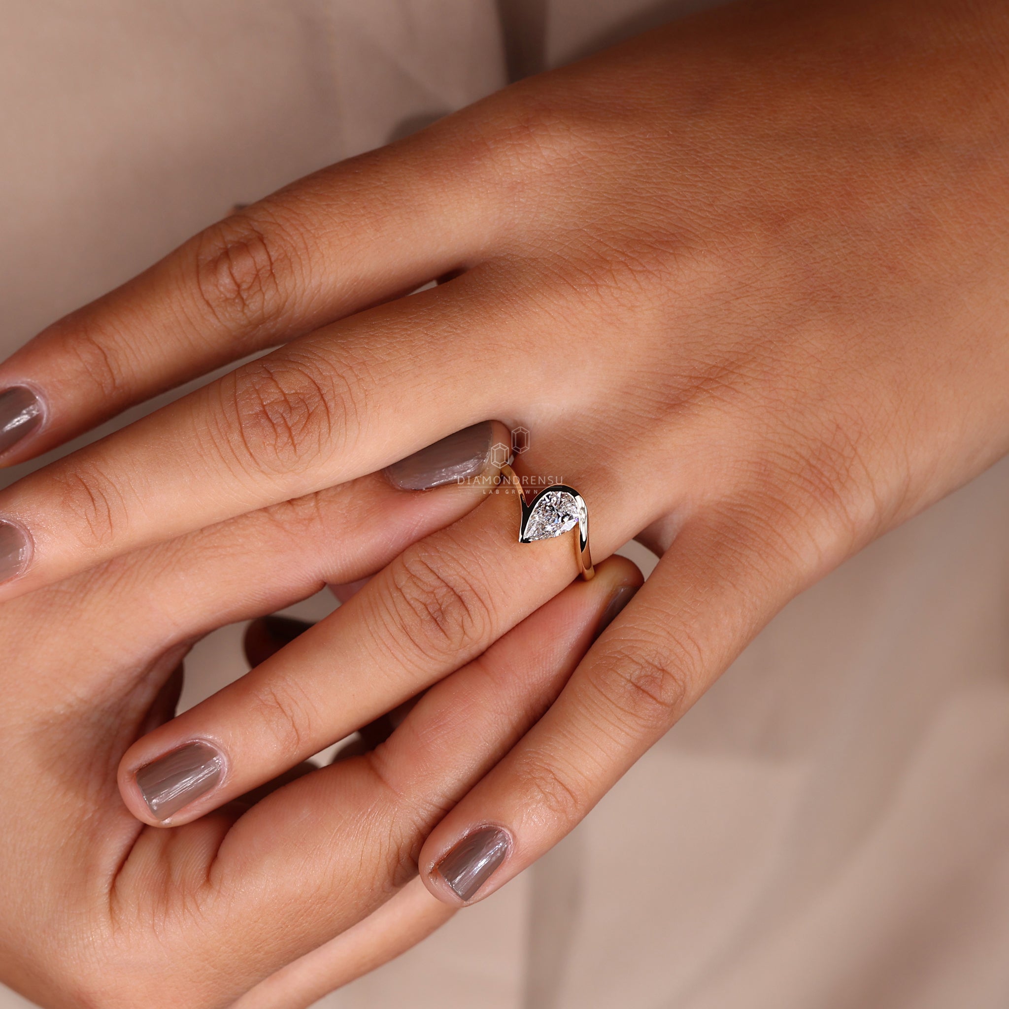 Handmade ring featuring an exquisite pear diamond.