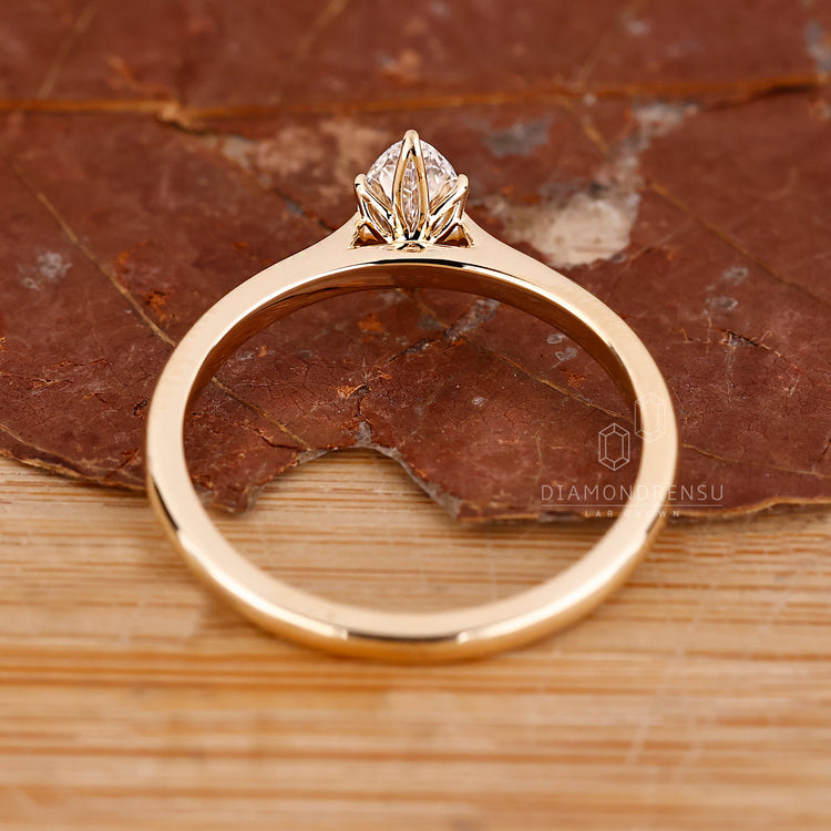 Custom engagement ring with tapered shank and solitaire style.
