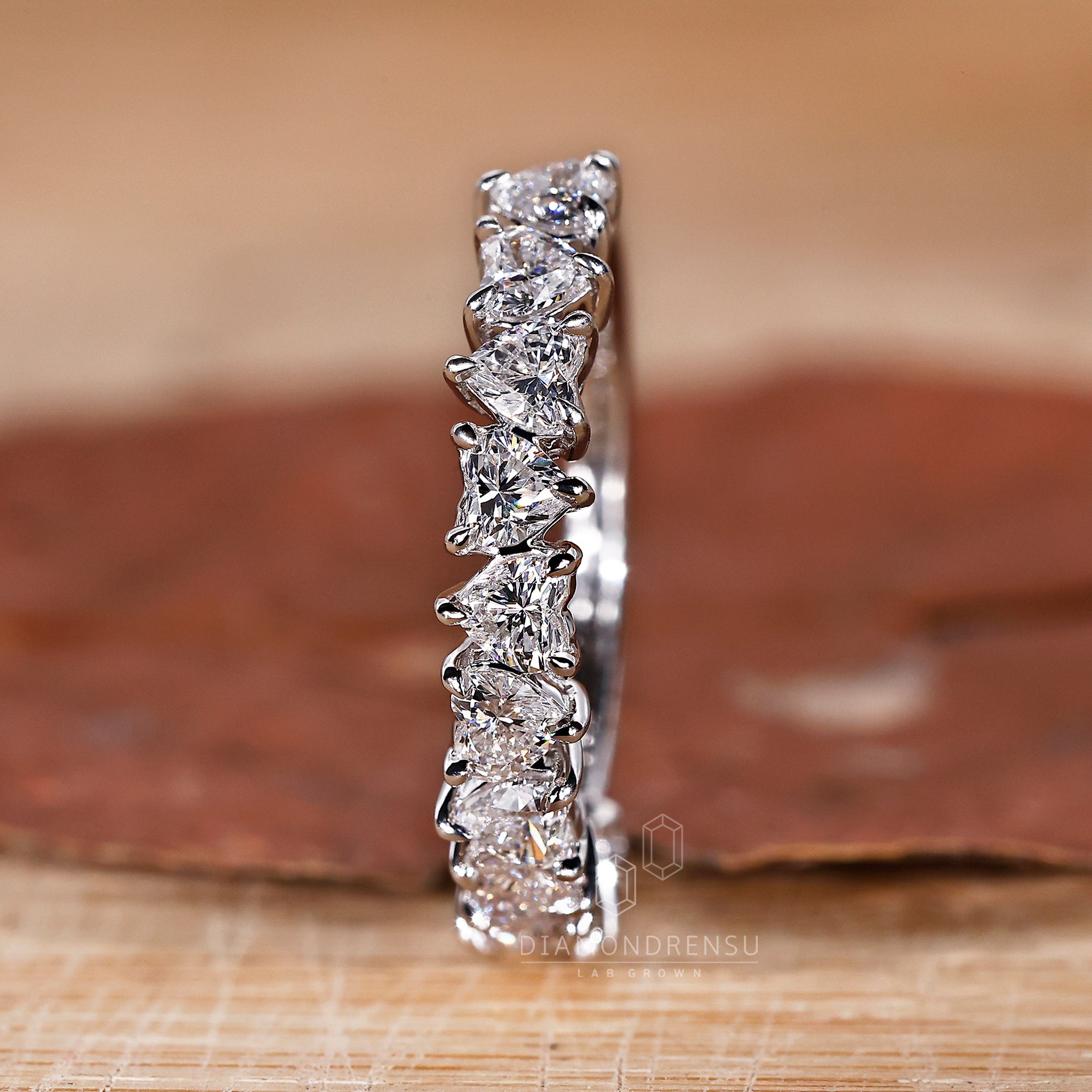 Wedding band UK with heart-shaped diamonds.

