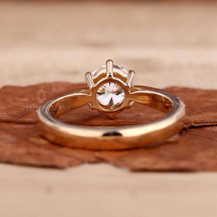 lab created diaRound cut diamond ring featuring a pave diamond ring design with a touch of sophistication.
mond ring