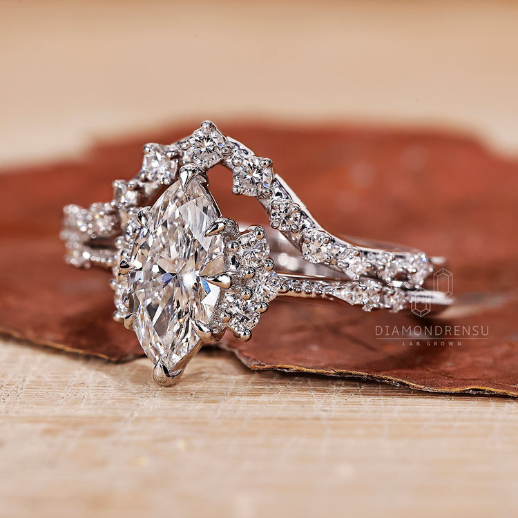 Vintage engagement ring in white gold bridal set with curved wedding band.
