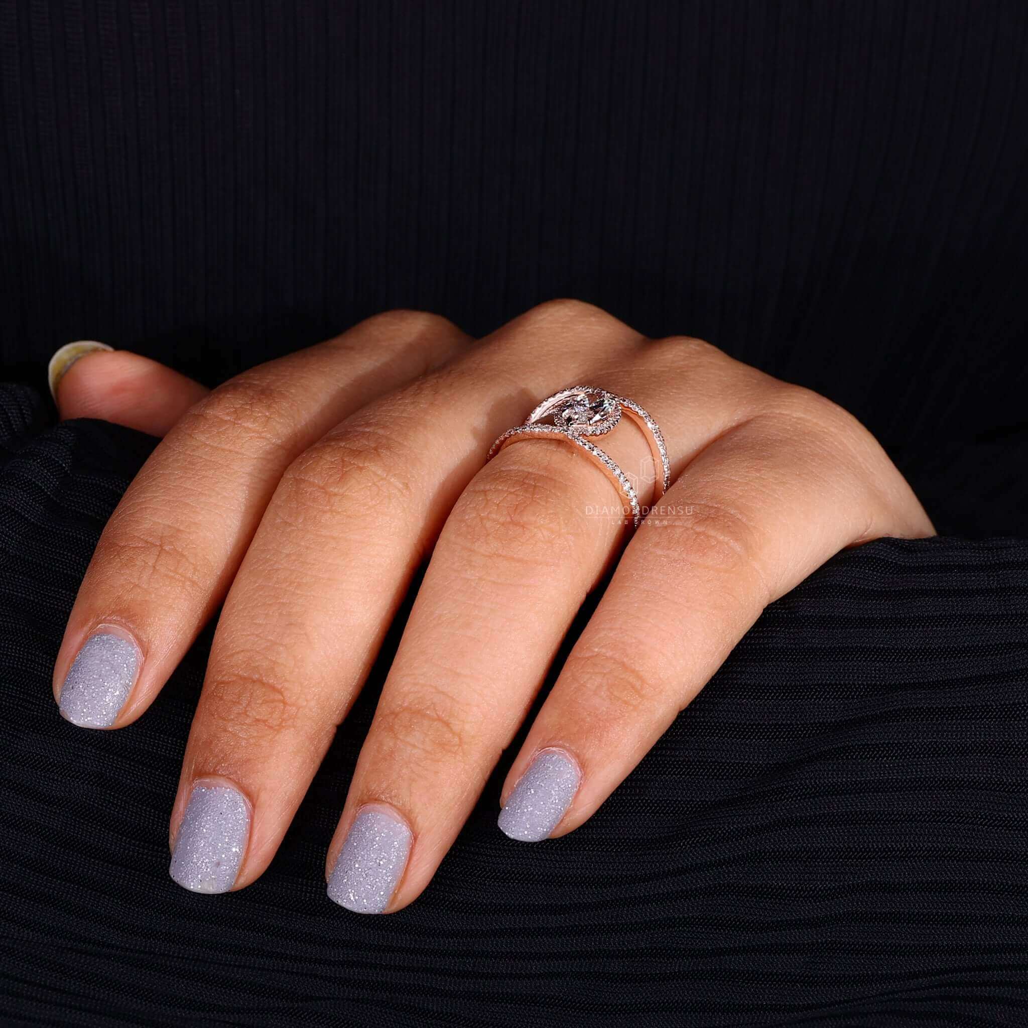 Halo ring ring designed with a marquise diamond and 4 prong claw setting for secure beauty.