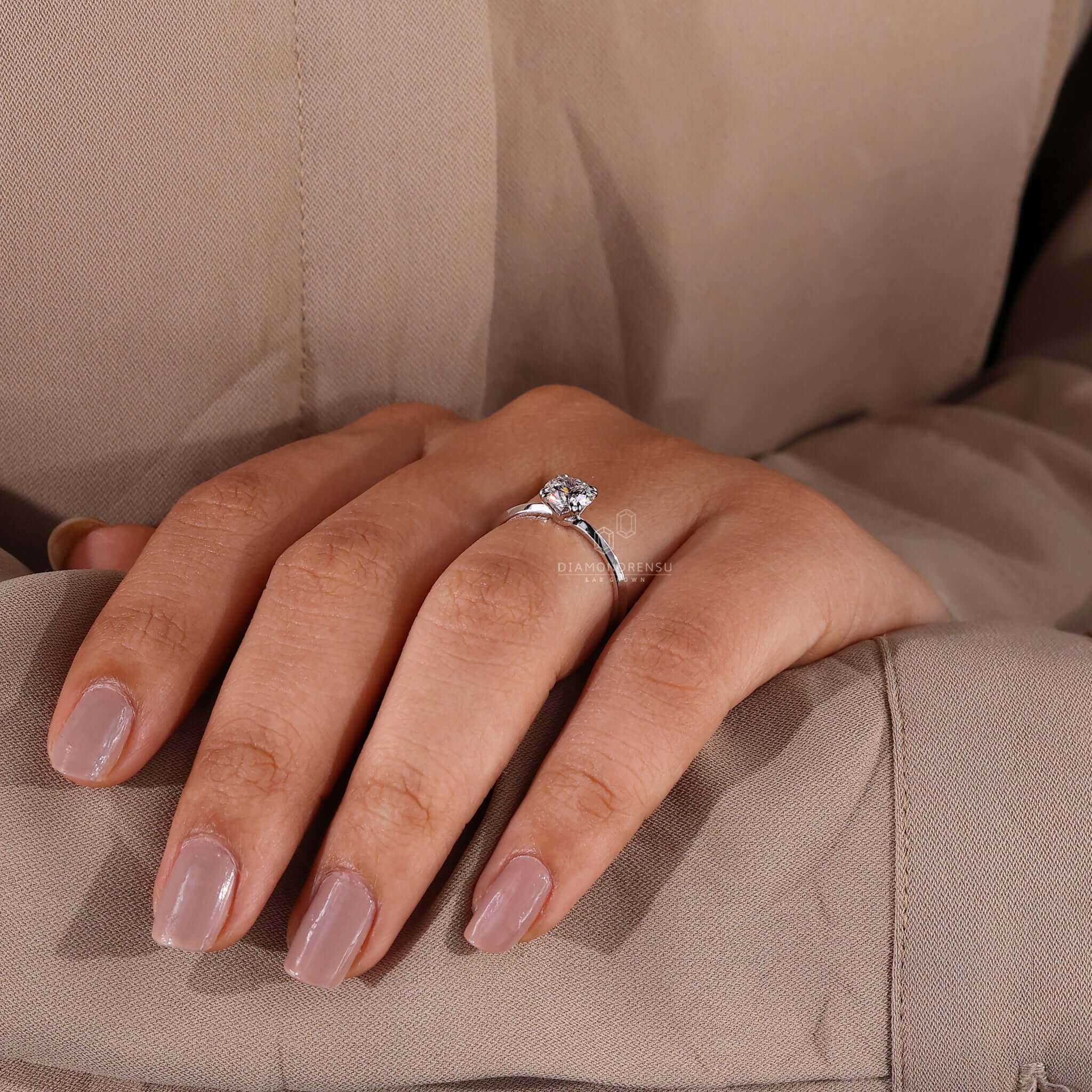 White gold ring with a claw prong ring setting featuring a lab grown diamond for sustainable elegance.