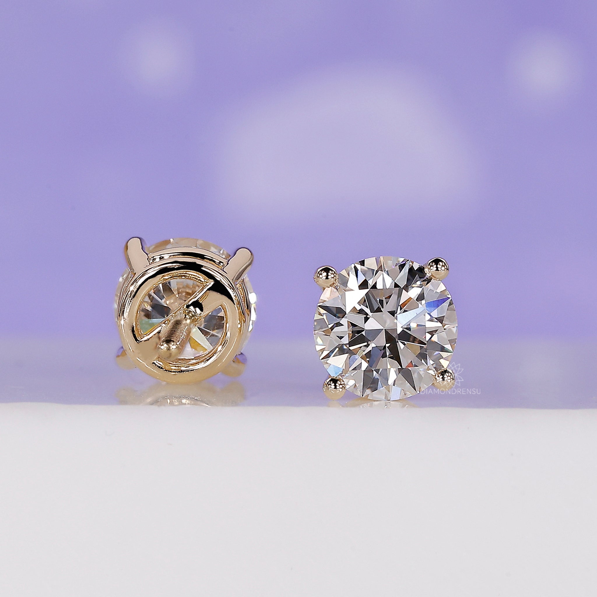 Elegant handmade earrings with lab grown round diamonds in gold setting.
