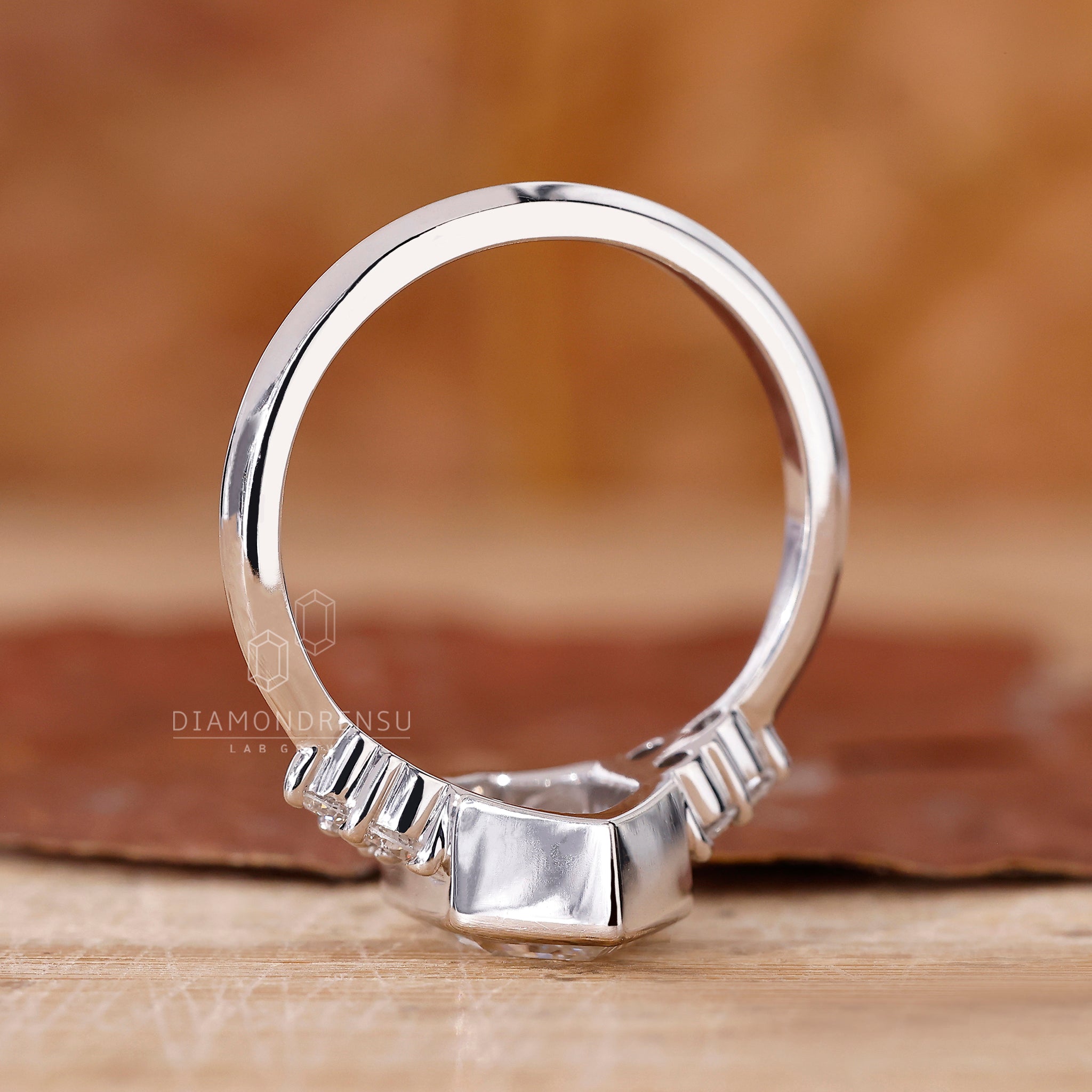 Custom engagement ring with bezel setting and lab grown diamond.
