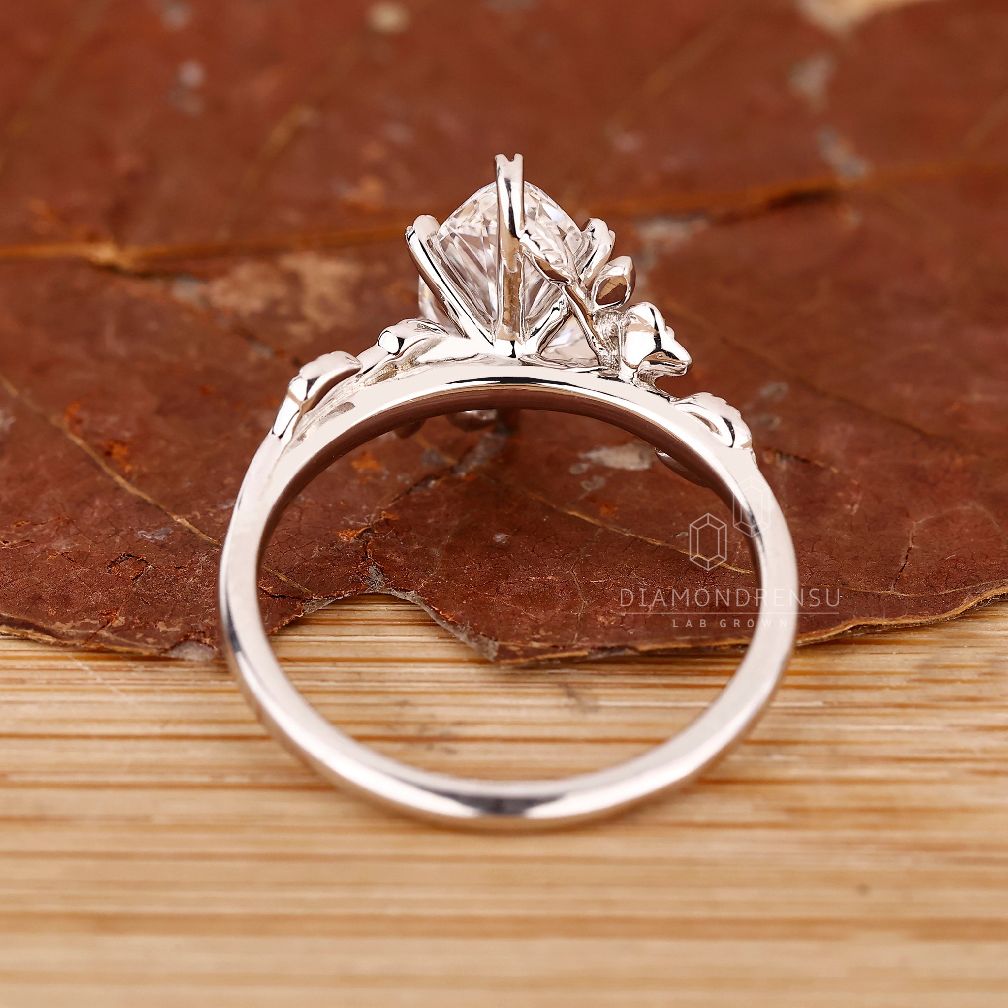 Unique ring with marquise center and leaf prongs.
