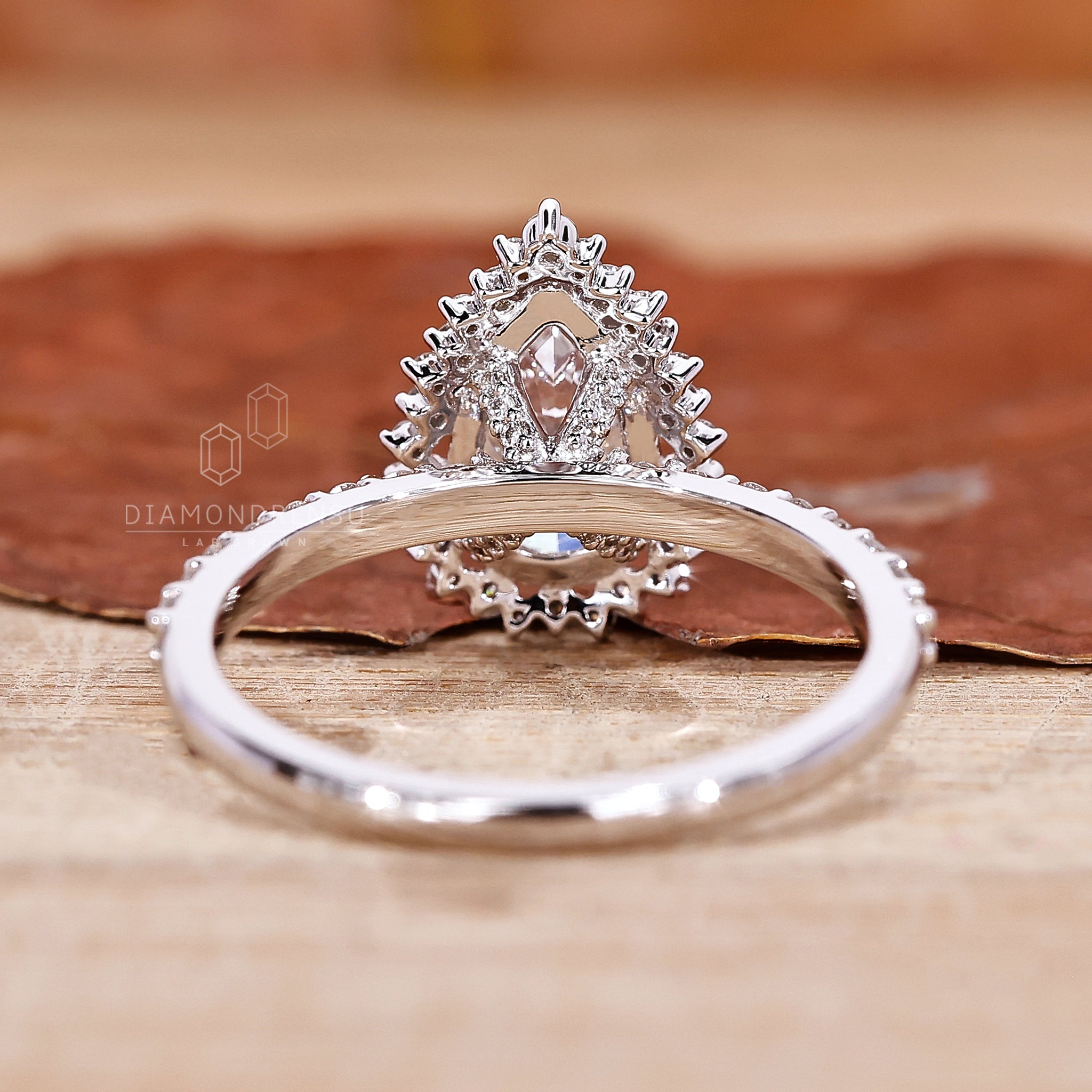Lab grown diamond set in a white gold pave diamond ring.
