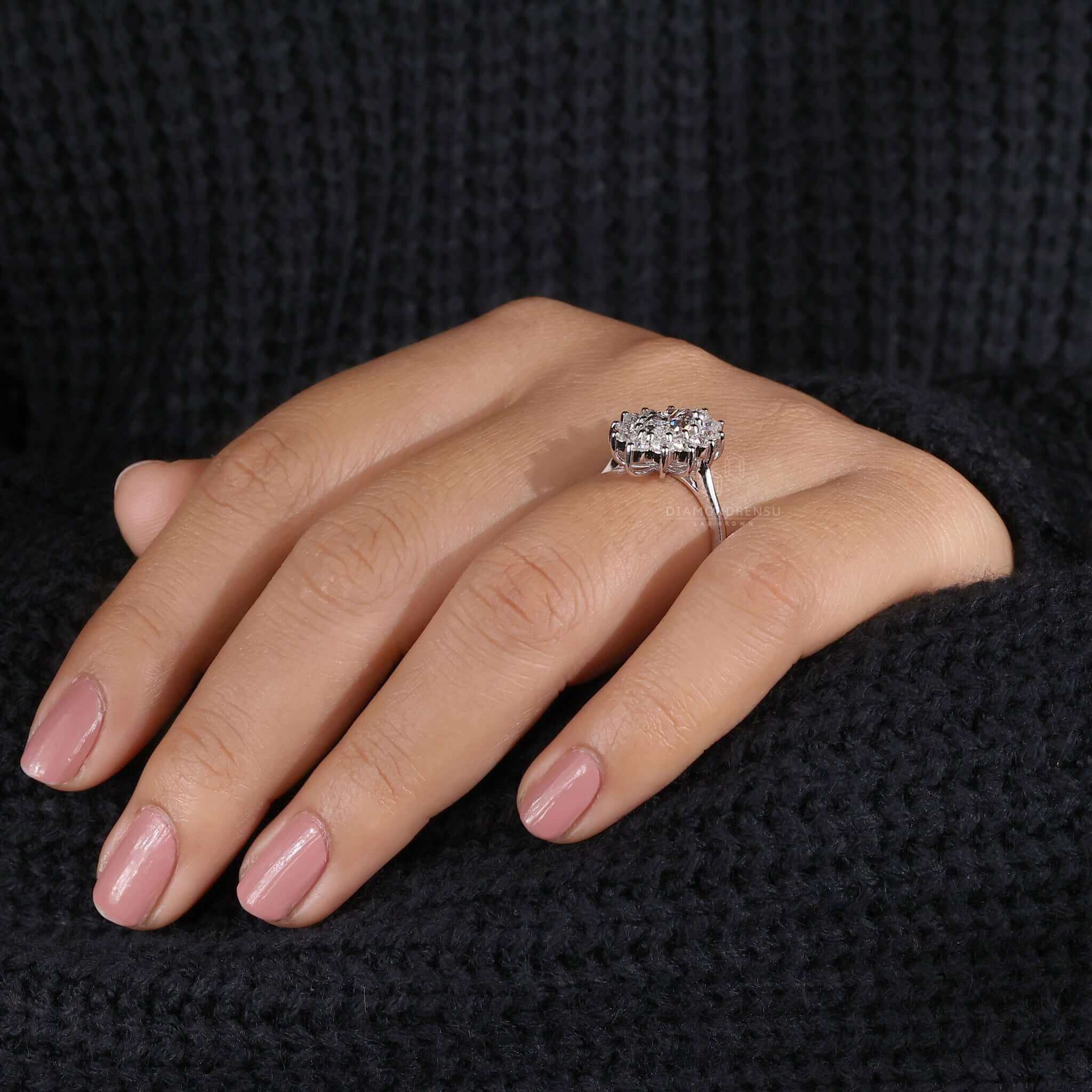 Marquise cut ring featuring brilliant cut diamond and handmade jewelry accents for a one-of-a-kind piece.
