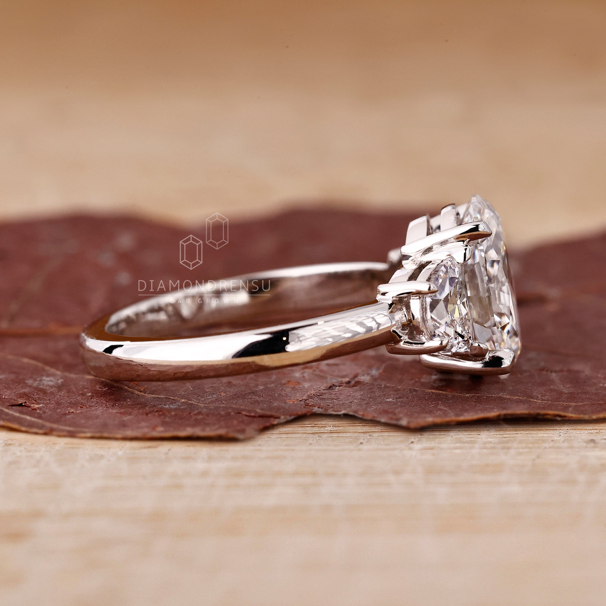 Handmade jewellery with oval and side stones by Diamondrensu UK.
