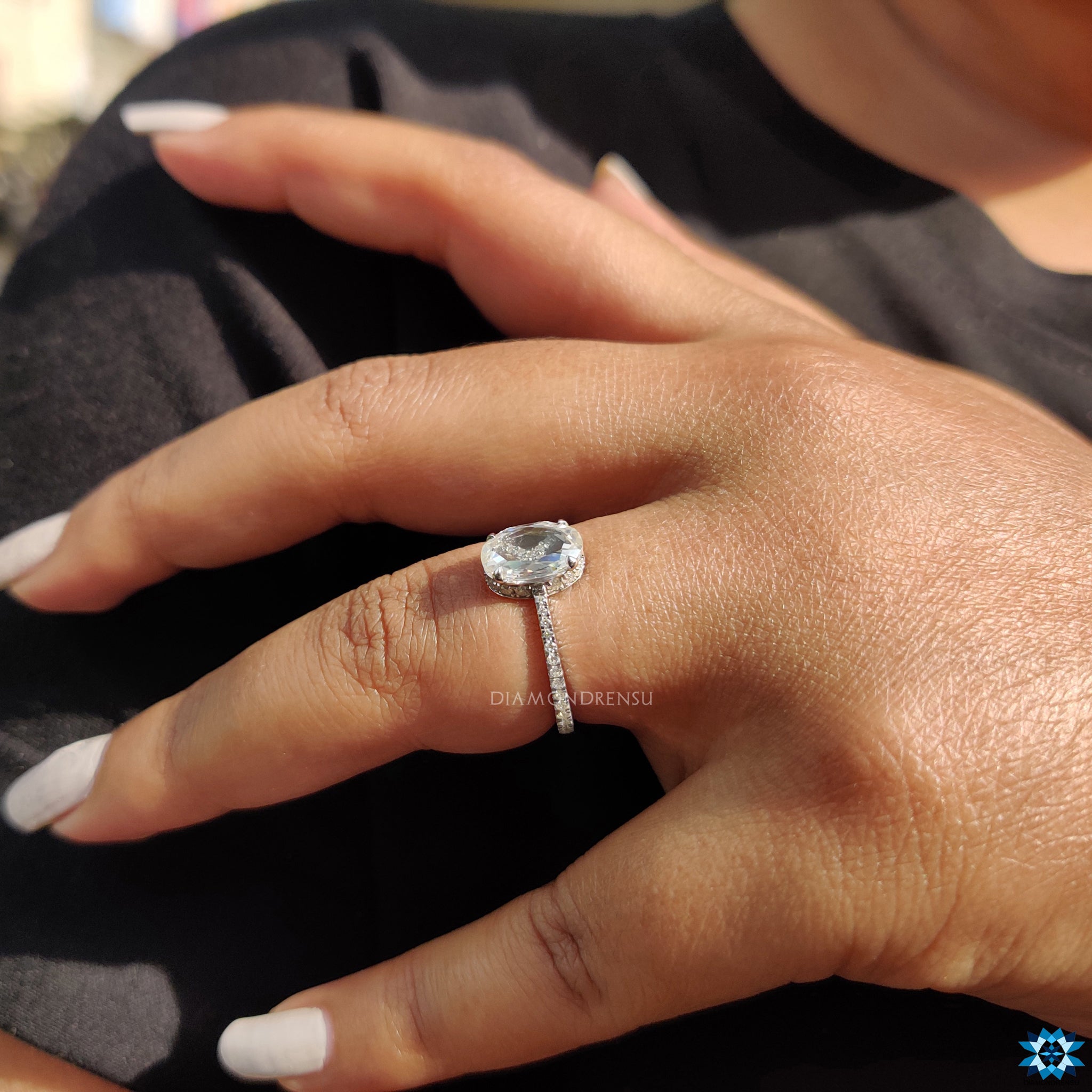 Elegant oval rose cut ring with 4 claw prong and hidden halo design.

