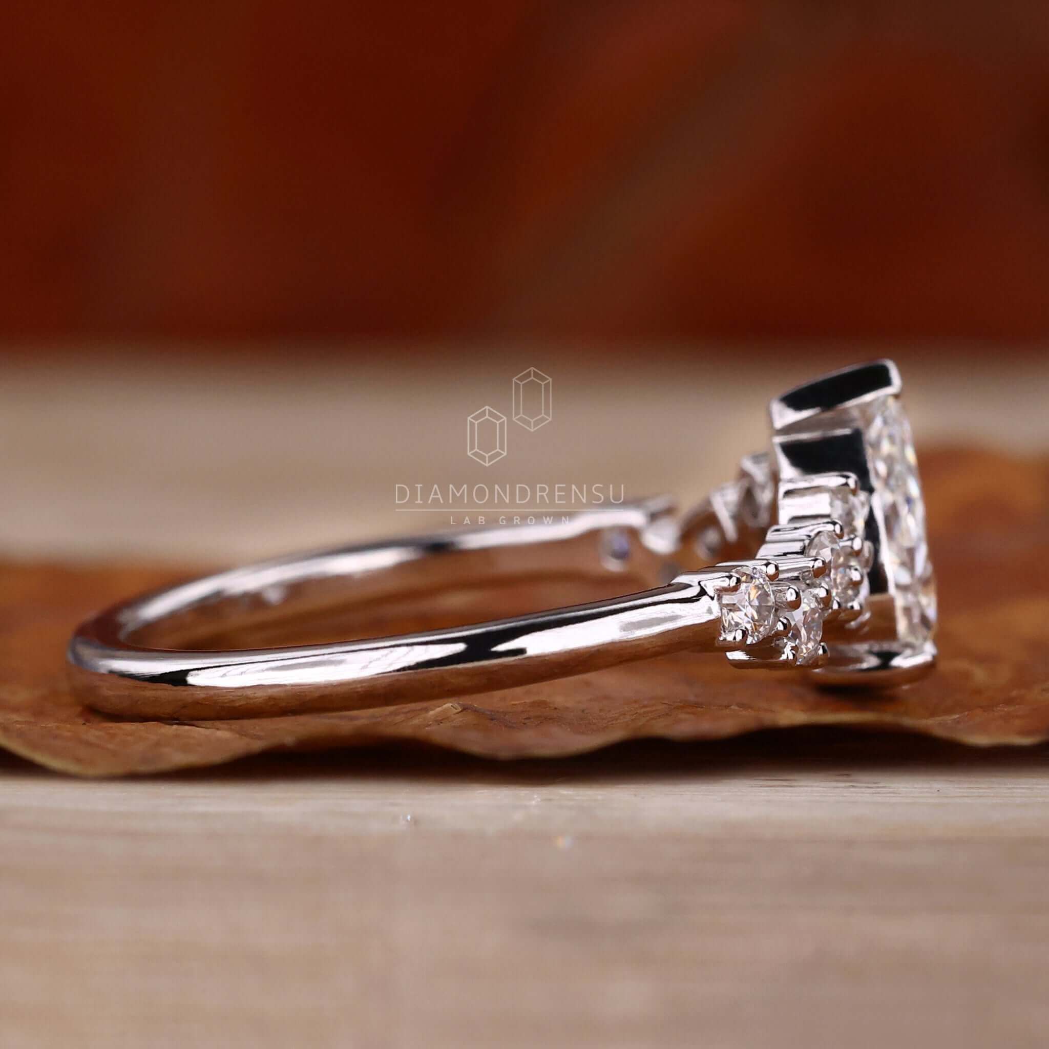 Lab grown pear diamond ring with handmade jewelry detailing, offering a sustainable option for elegant engagements.
