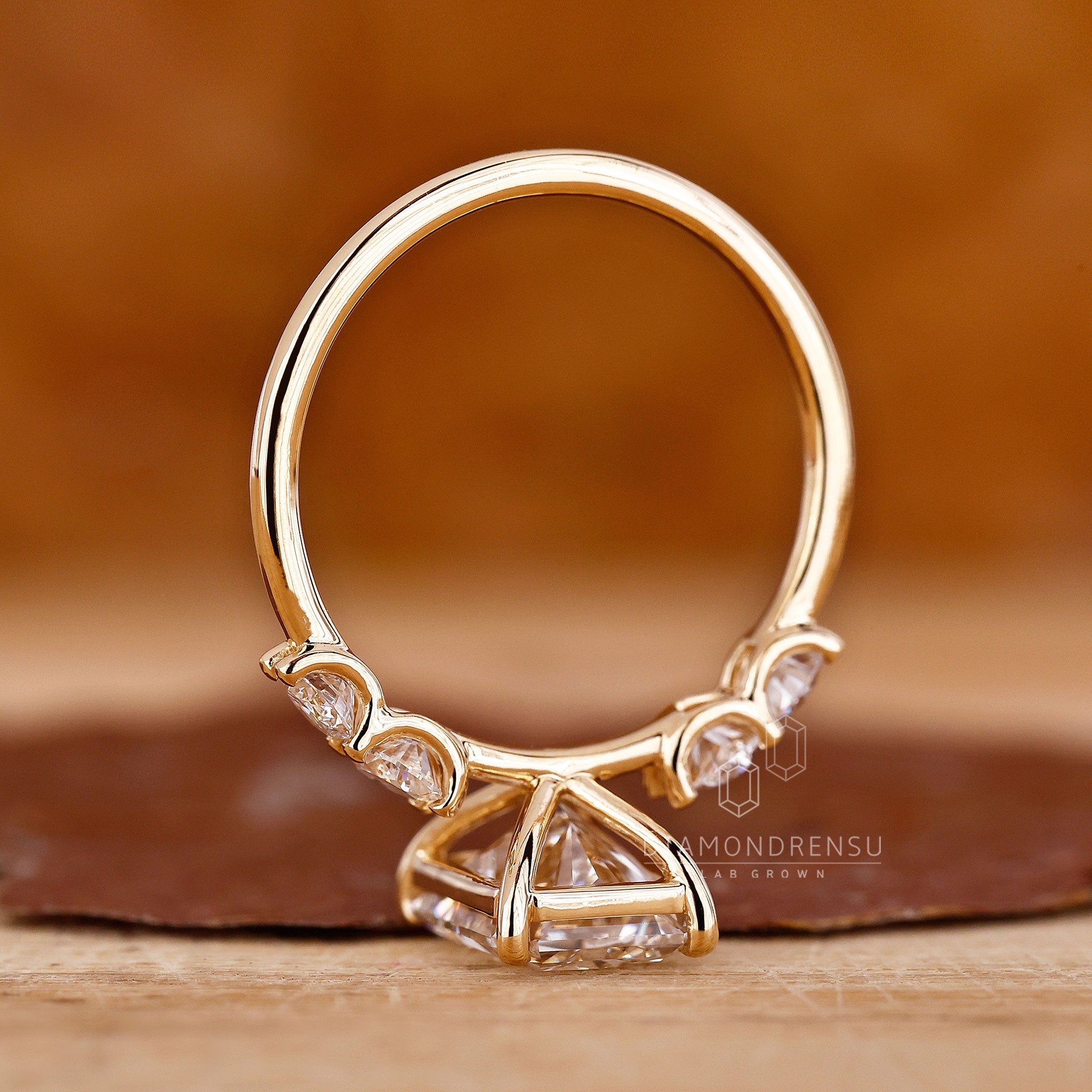 Diamond ring UK includes round and radiant diamonds together.
