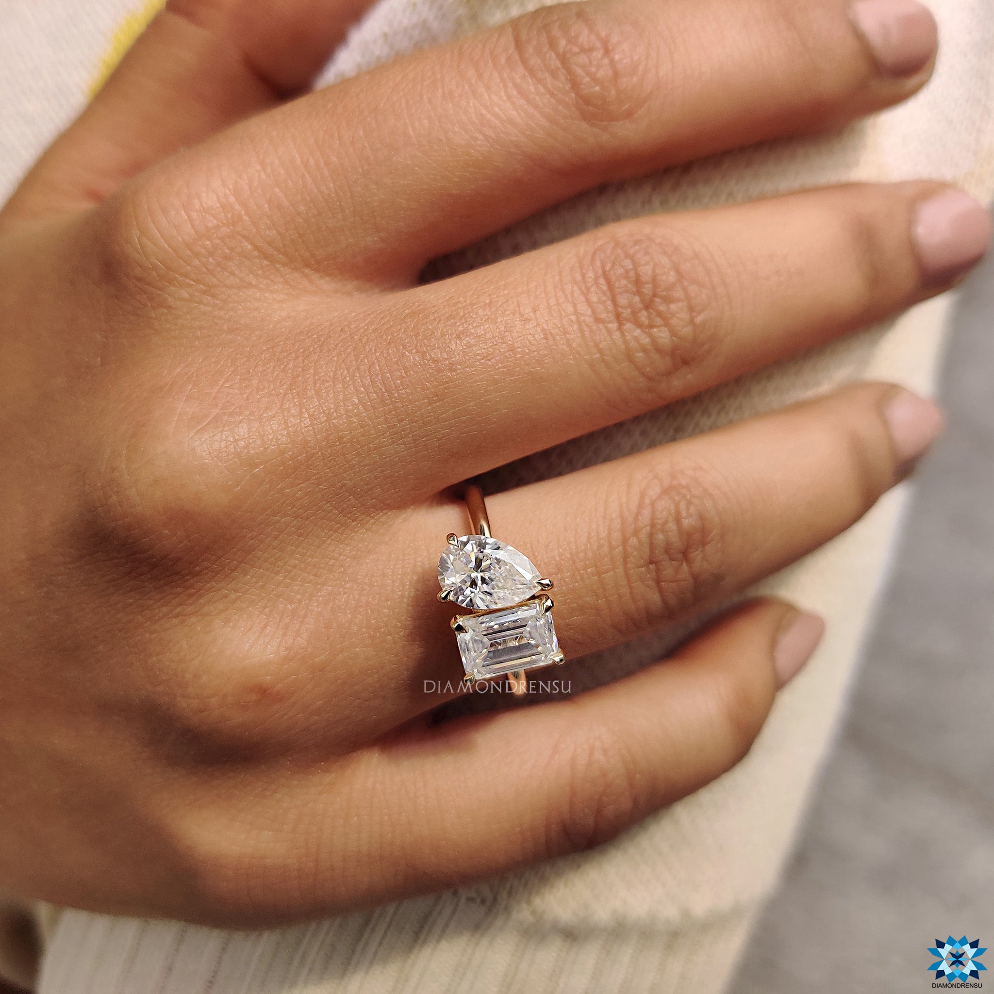 Claw prongs in pear and emerald cut ring
