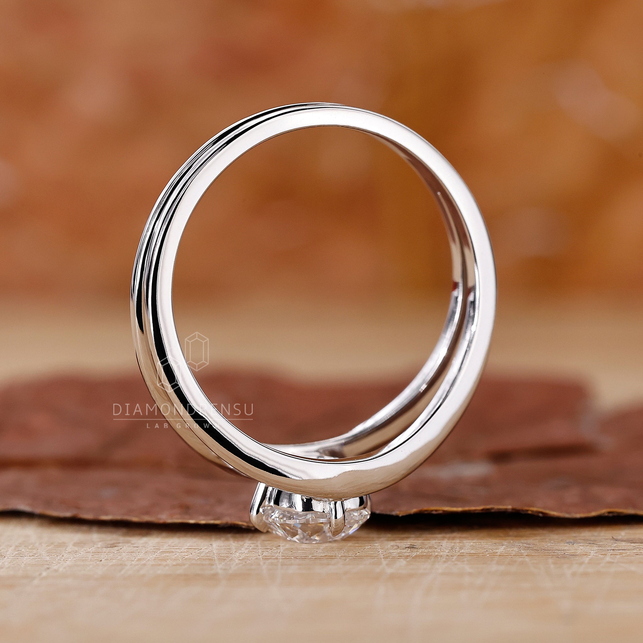 UK engagement ring styled as solitaire diamond ring.
