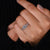 Round cut engagement ring featuring prong setting details.
