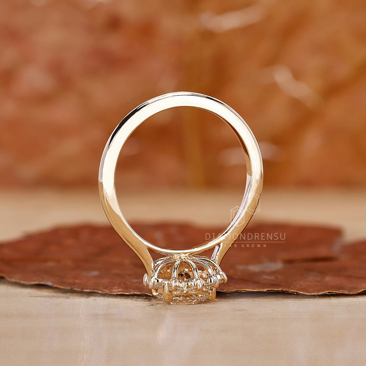 Engagement ring yellow gold styled as diamond cluster ring.
