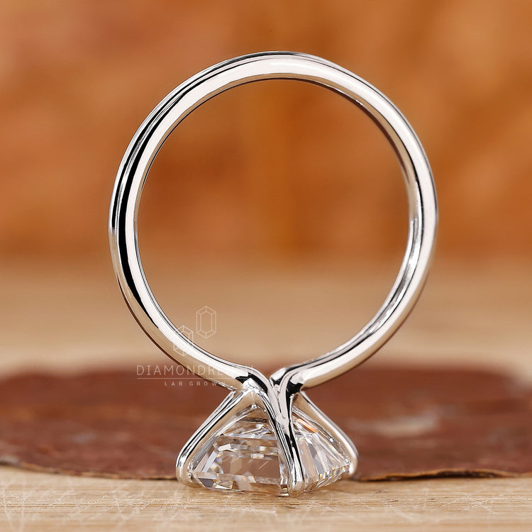 Handmade ring with asscher cut is designed in a clean solitaire structure.
