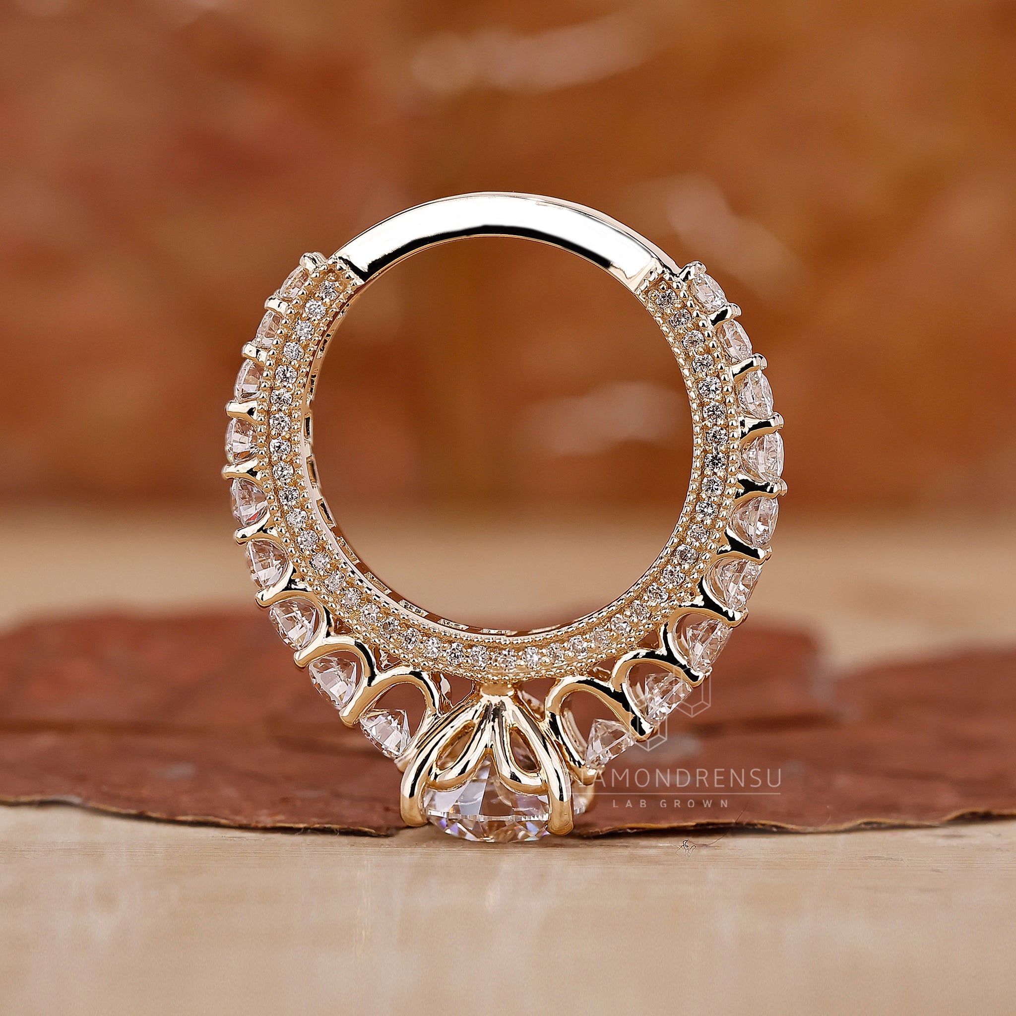 Yellow gold ring by Diamondrensu UK with pave setting.
