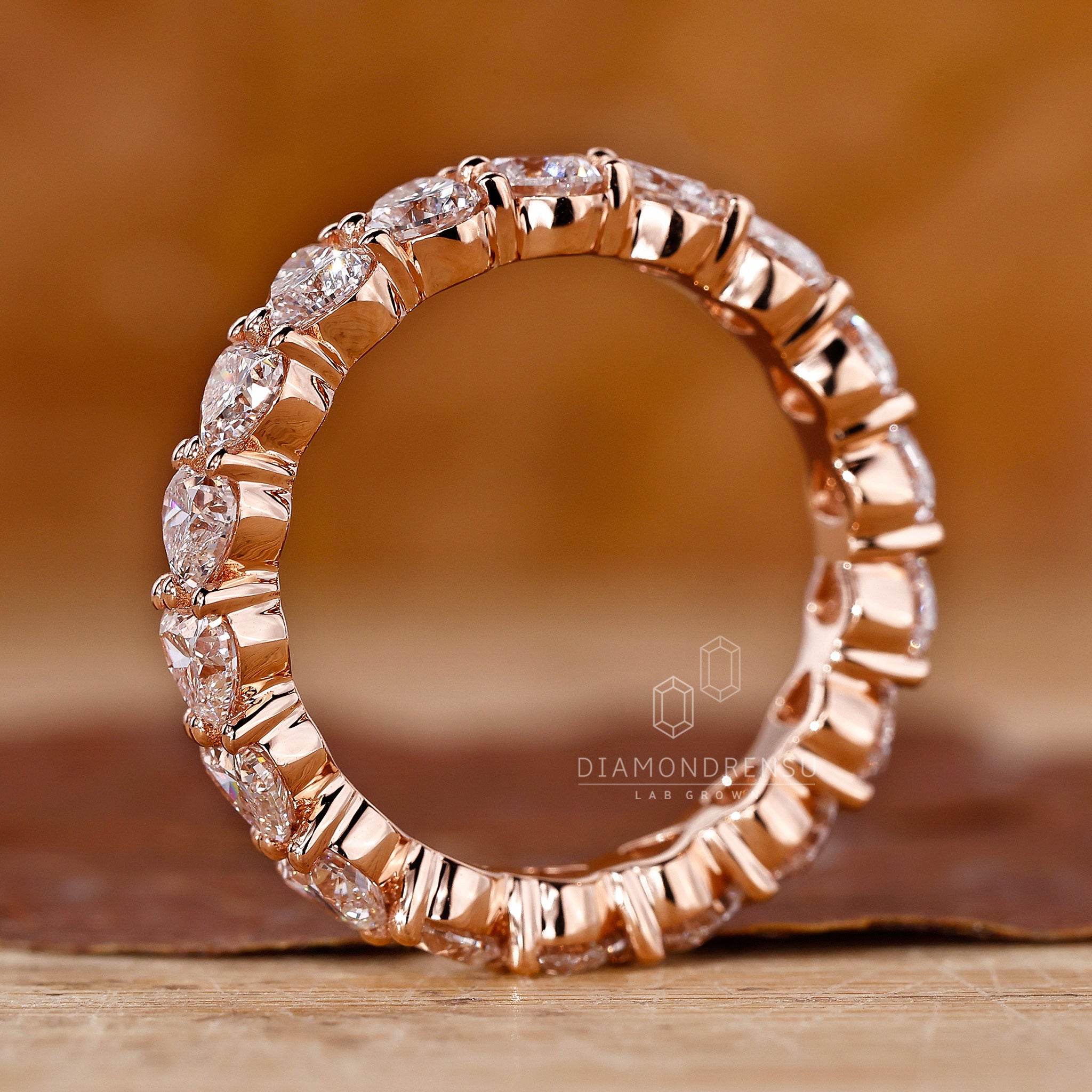Unique heart shaped diamond band in gold.
