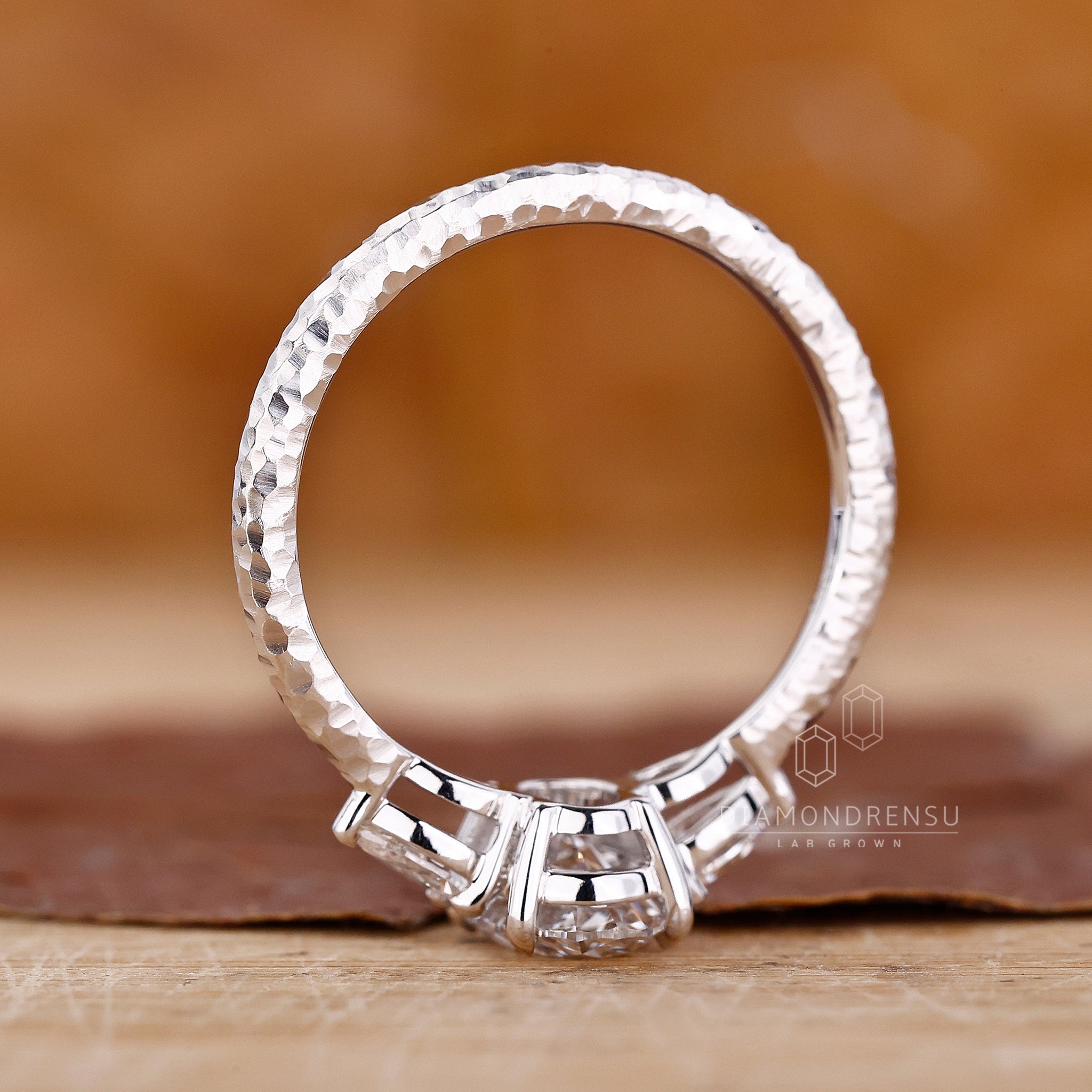 3 Stone Diamond Engagement Ring with hammer finish shank ring.
