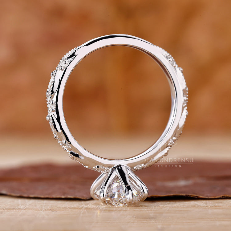 Custom engagement ring with marquise shape outline.
