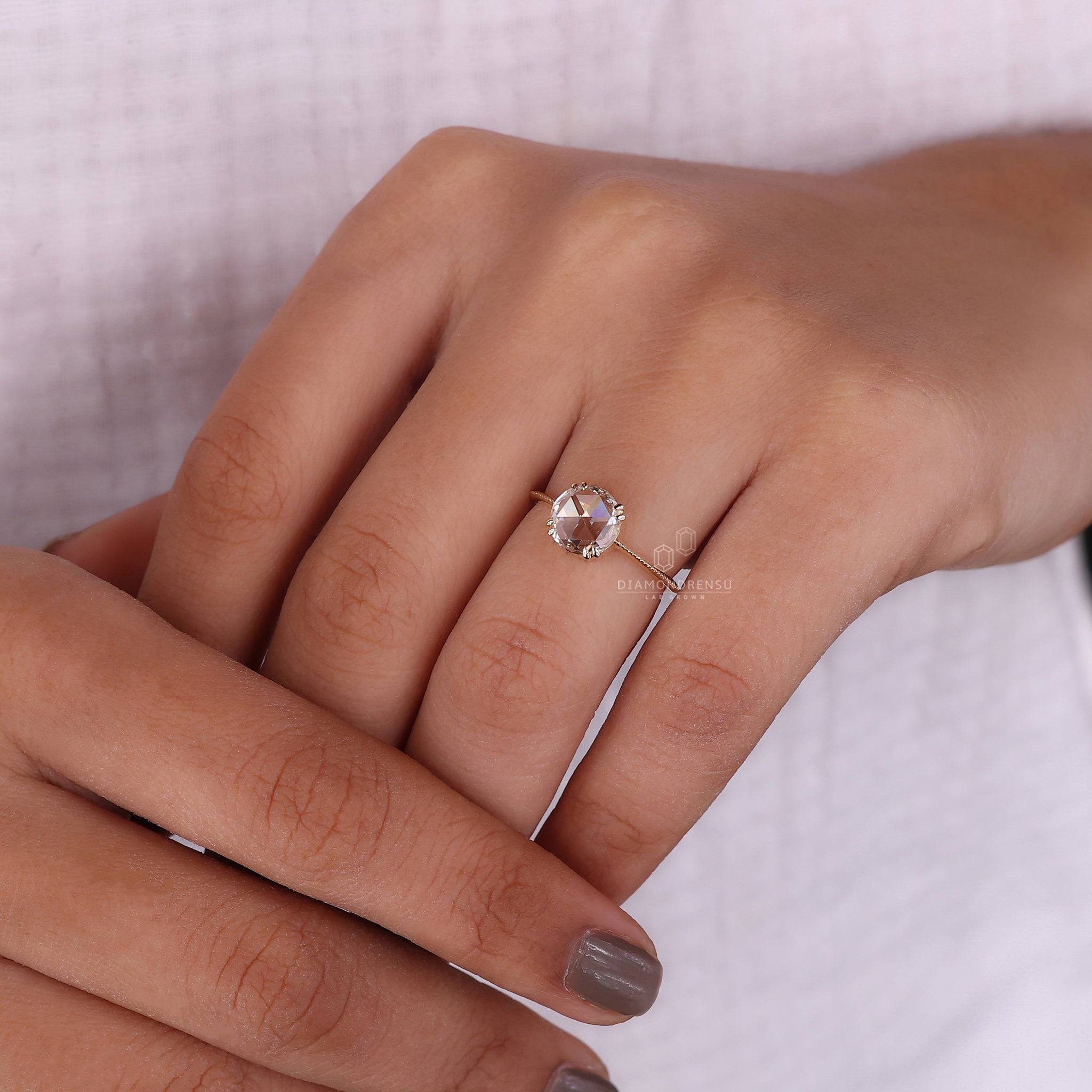 Diamondrensu UK engagement ring with double claw prong and knife edge shank.
