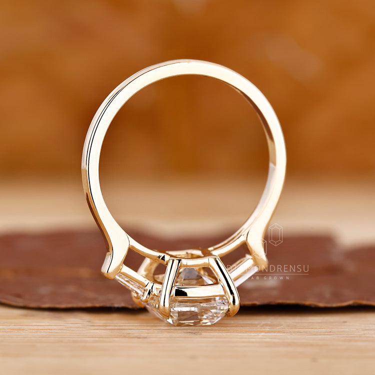 Designer engagement ring with cushion diamond center.
