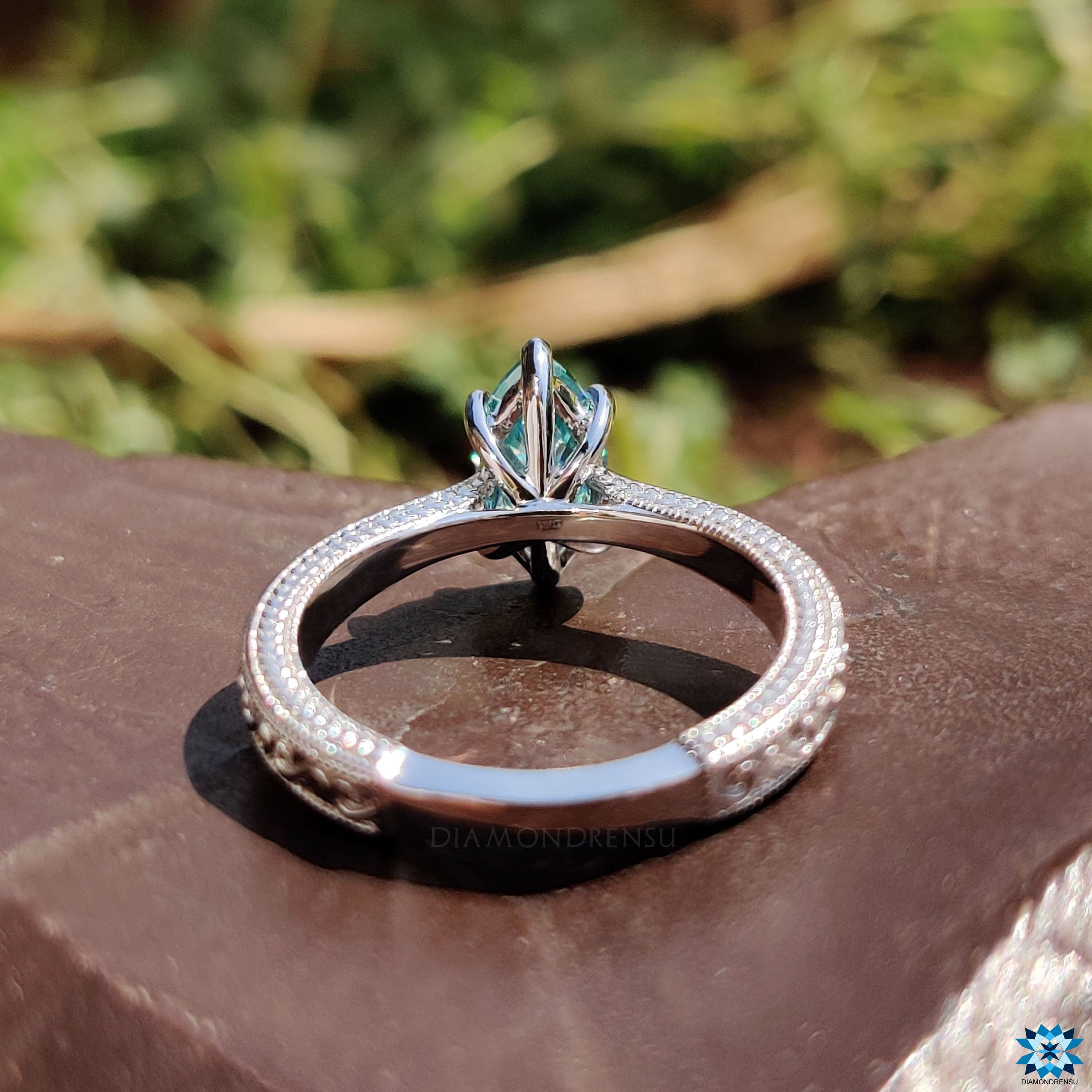 Marquise moissanite ring in UK with Art Deco styling and white gold band.
