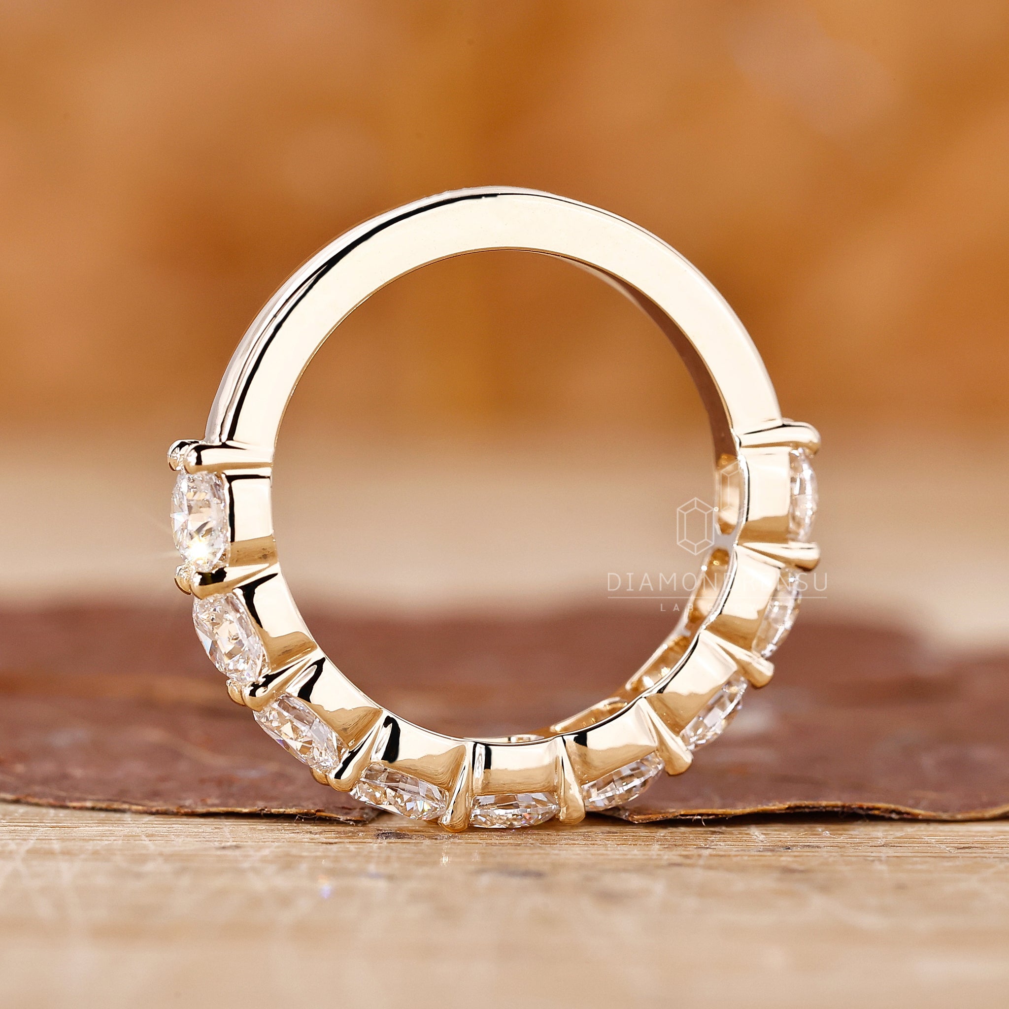 Round wedding band in half eternity setting
