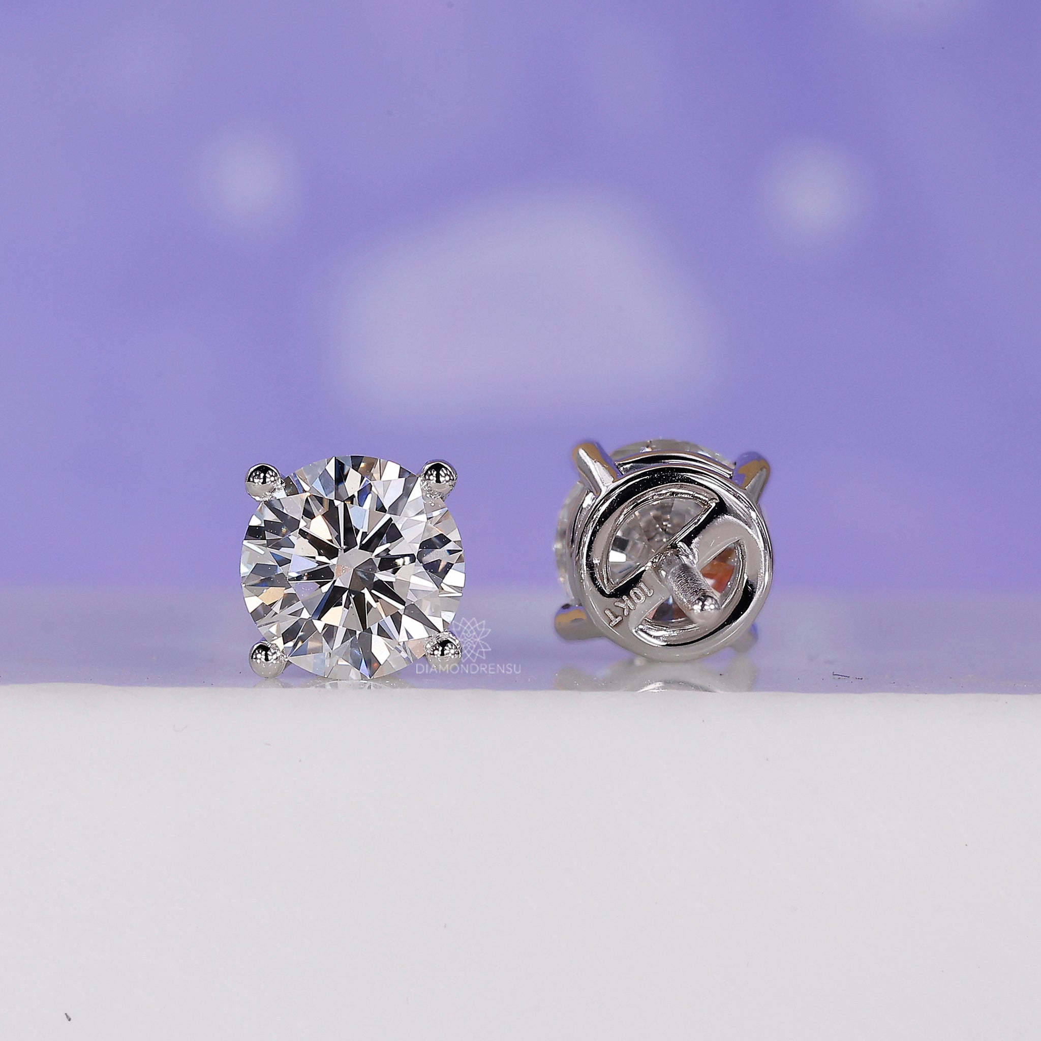 Minimalist diamond stud earrings.