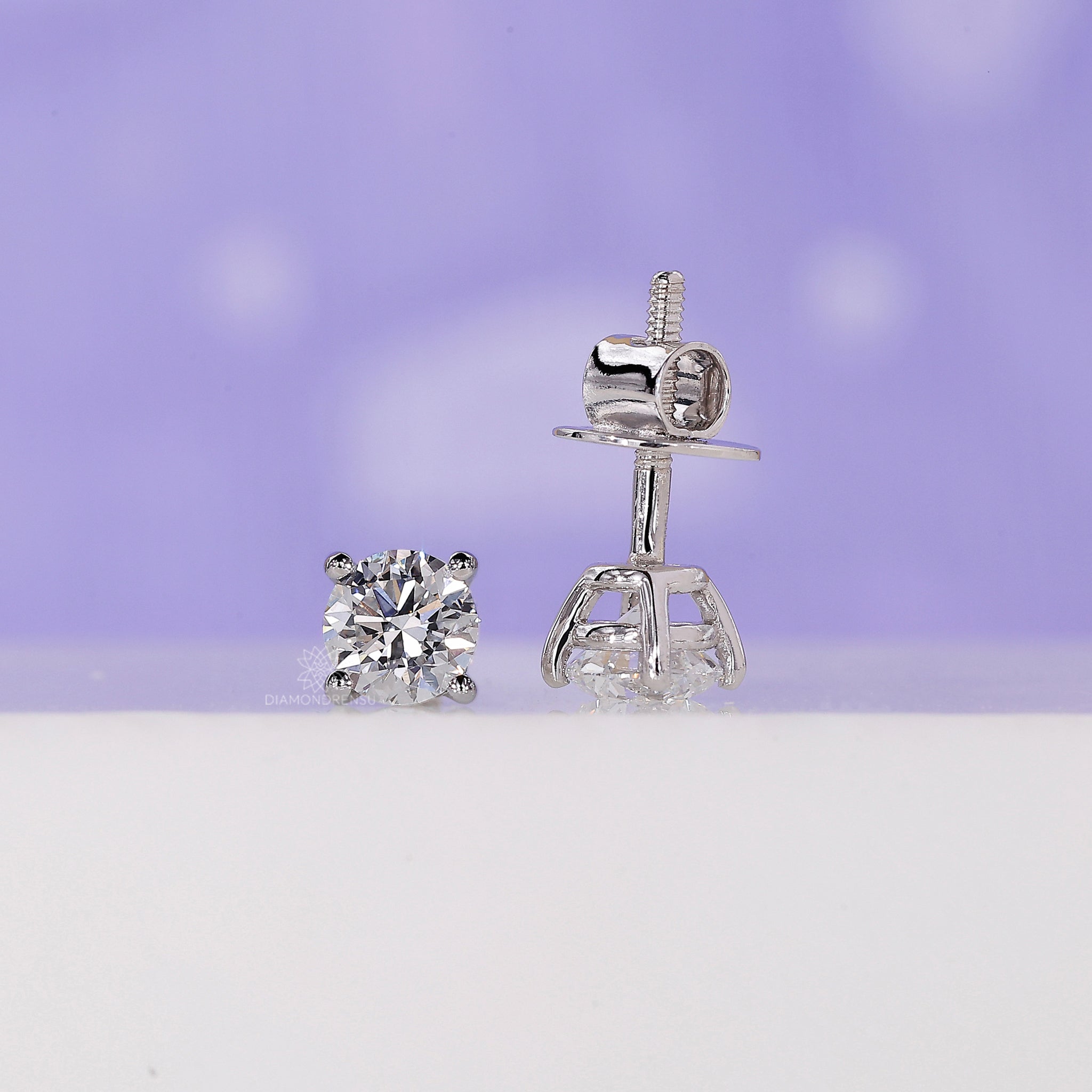 White gold handmade earrings set with brilliant lab grown diamonds.