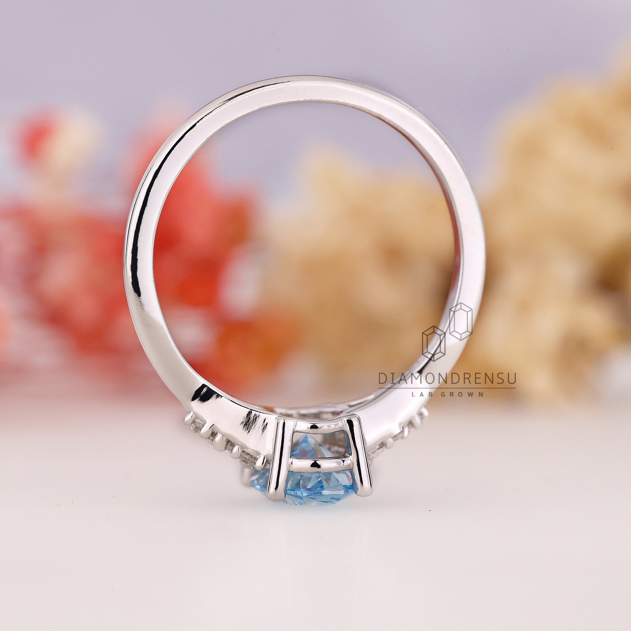 Buy engagement ring in London UK with marquise and round diamonds.
