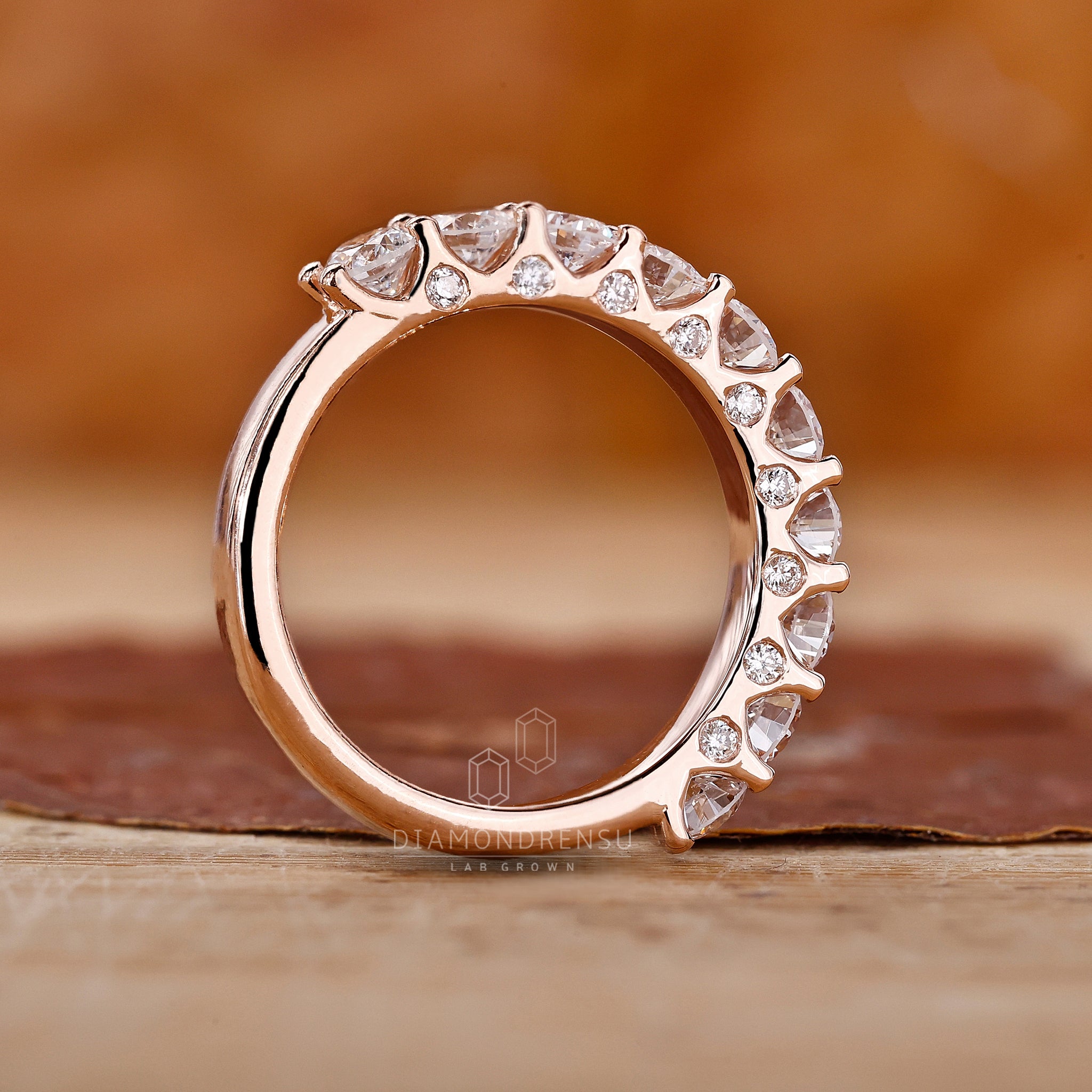 Round diamond wedding band with rose gold
