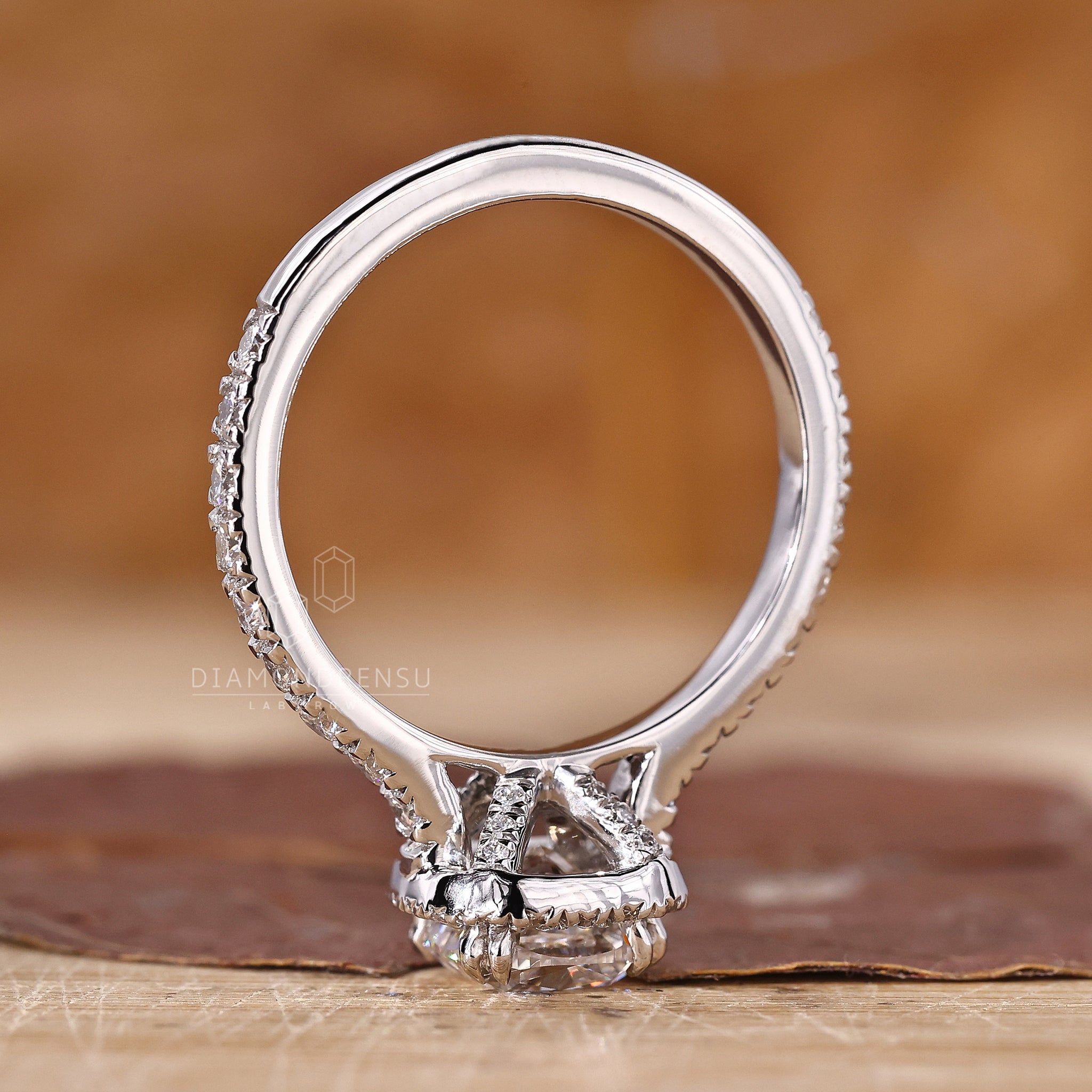 Pave setting ring with hidden accents for engagement in white gold.
