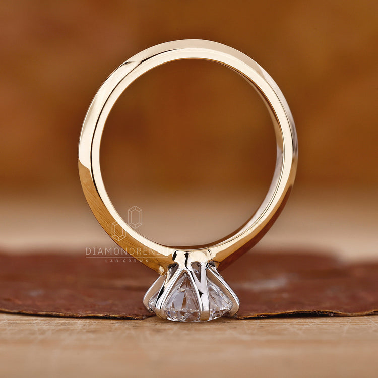 Custom diamond ring in two tone style with elegant round cut centre.
