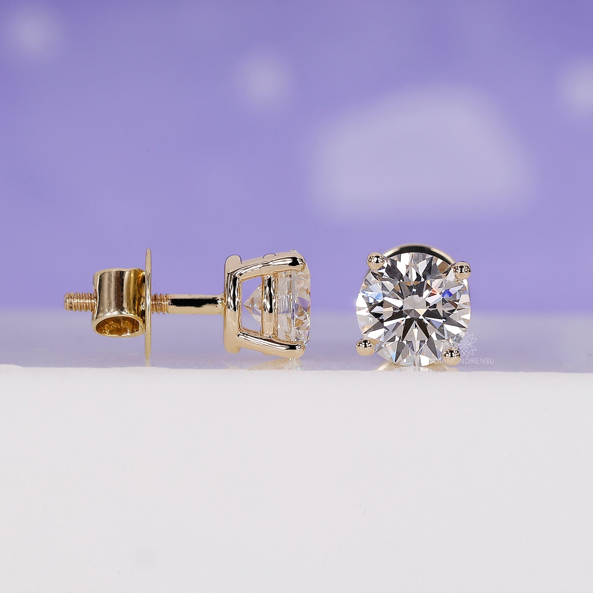 Elegant handmade gold earrings with lab grown round diamonds.